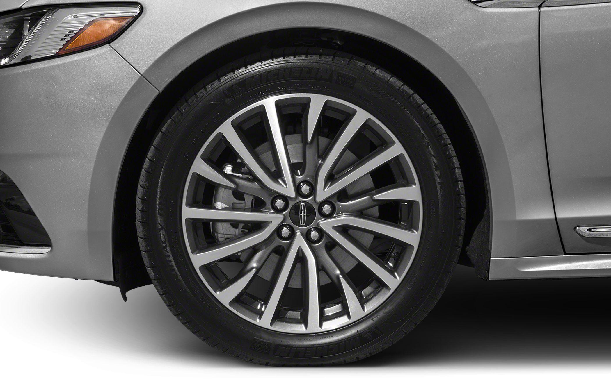 Close-up of alloy wheel and tire with detailed spokes and brake disc