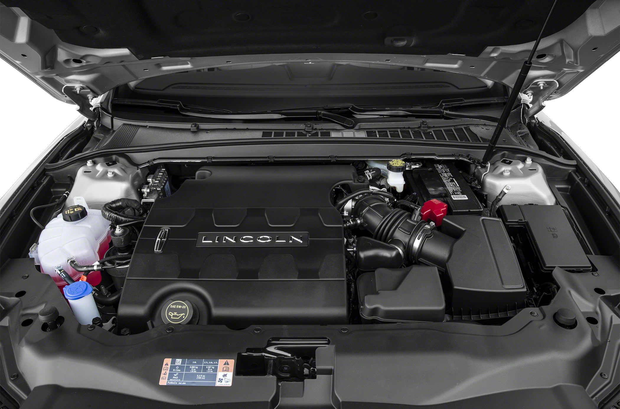 Covered engine bay with visible fluid reservoirs and intake system