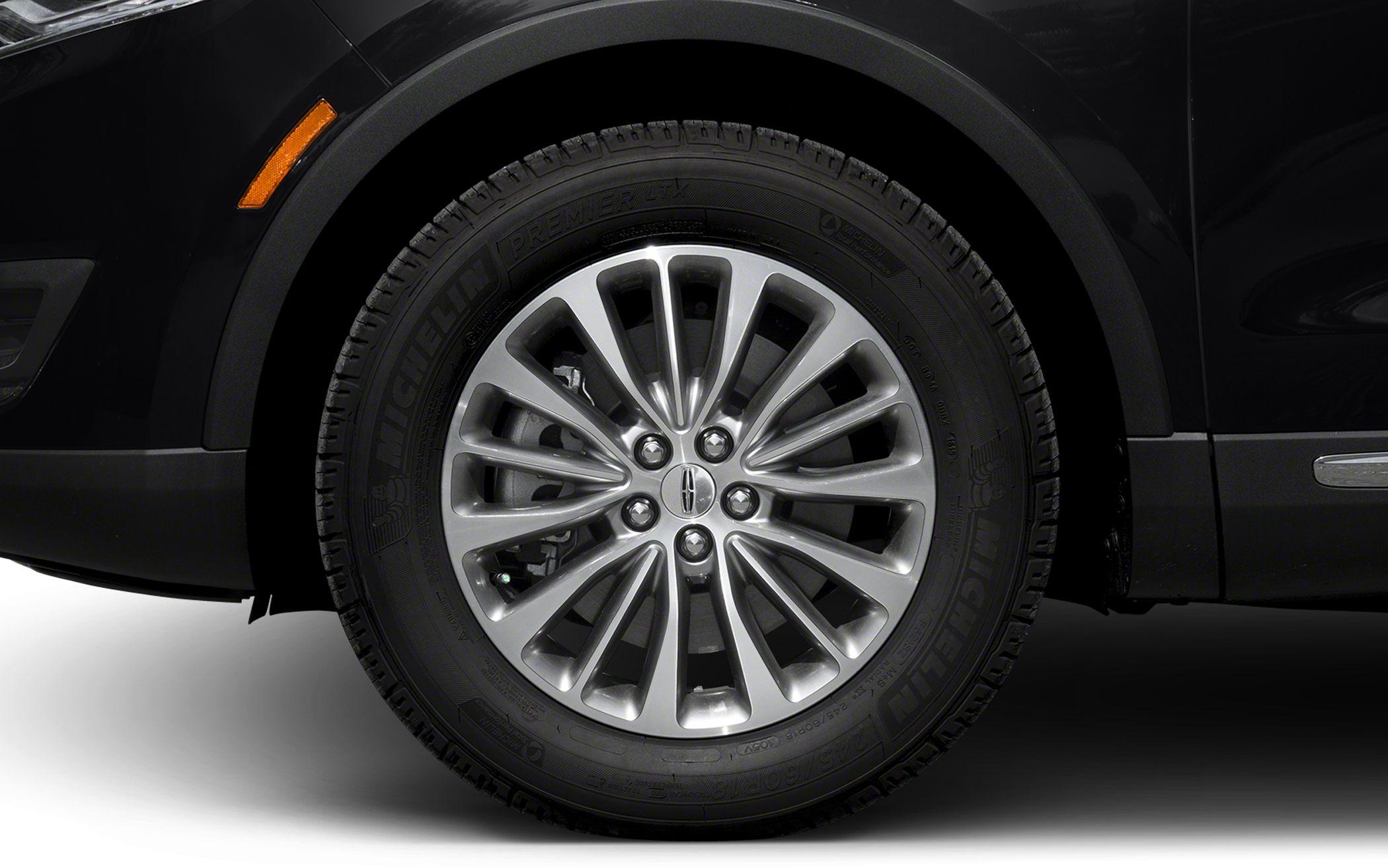 Close-up of multi-spoke alloy wheel with Michelin tire on an SUV