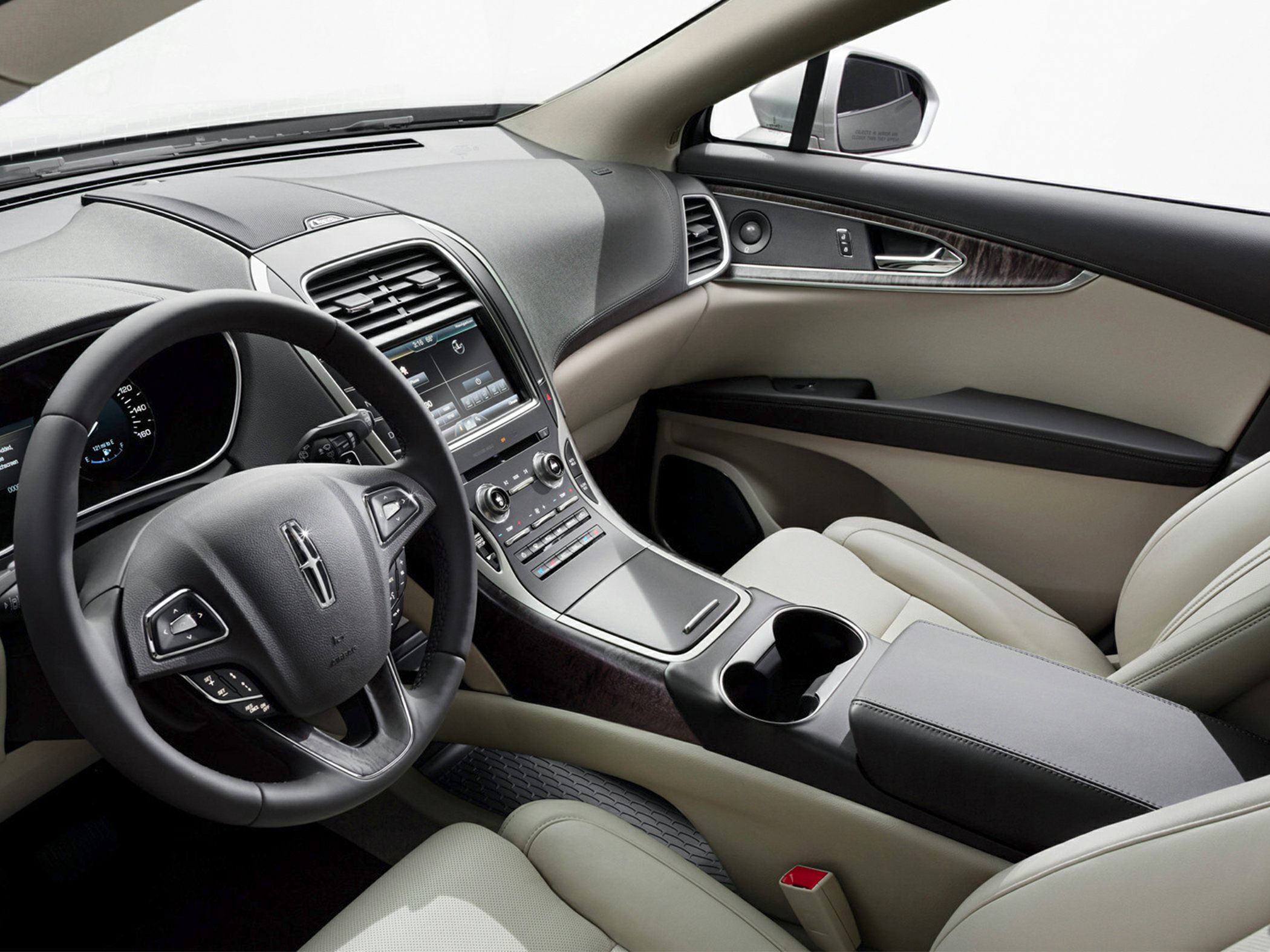 Luxury car interior with infotainment system and multifunction steering wheel
