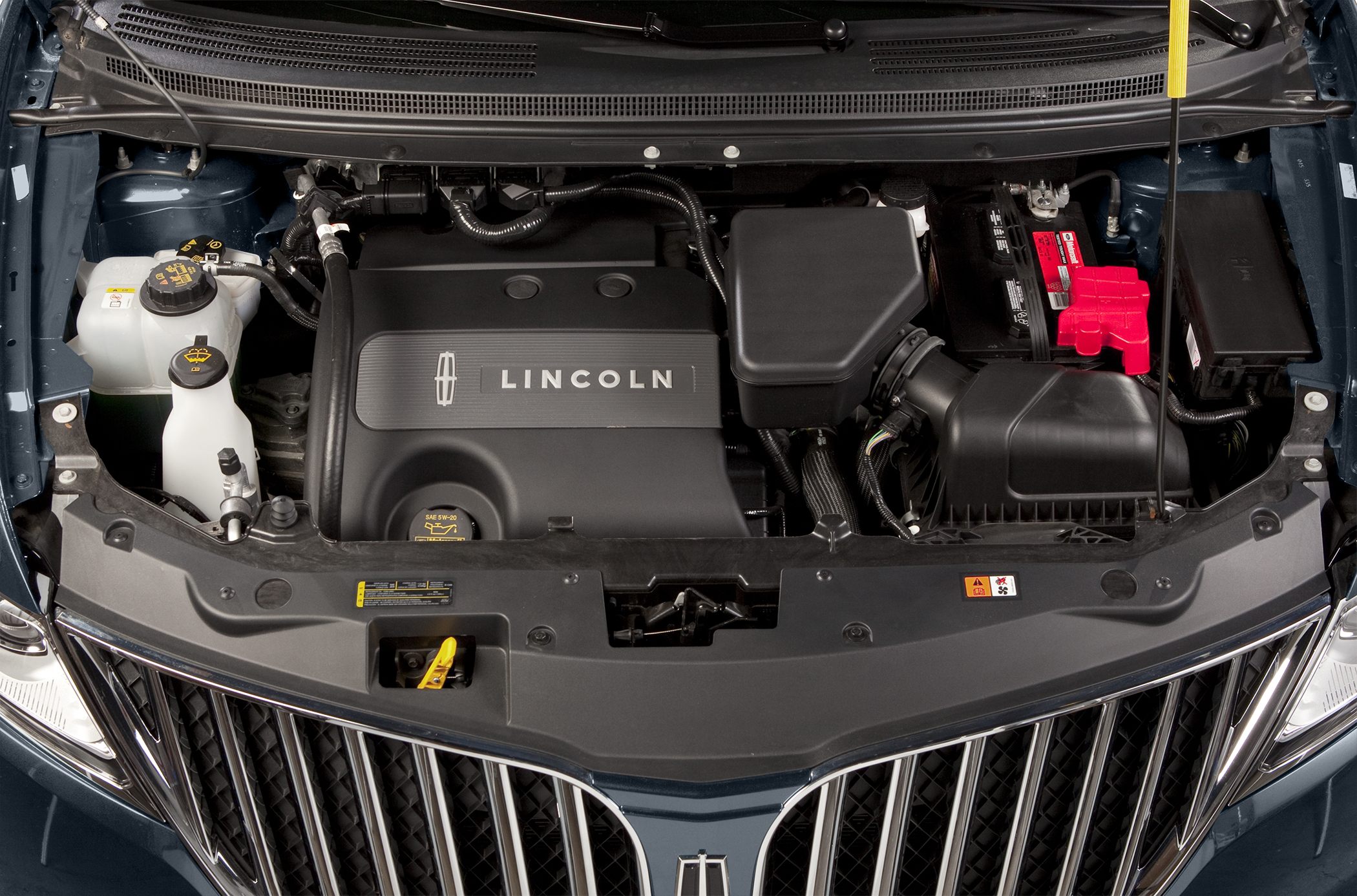 Engine bay layout with Lincoln-branded engine cover and visible battery and fluid reservoirs