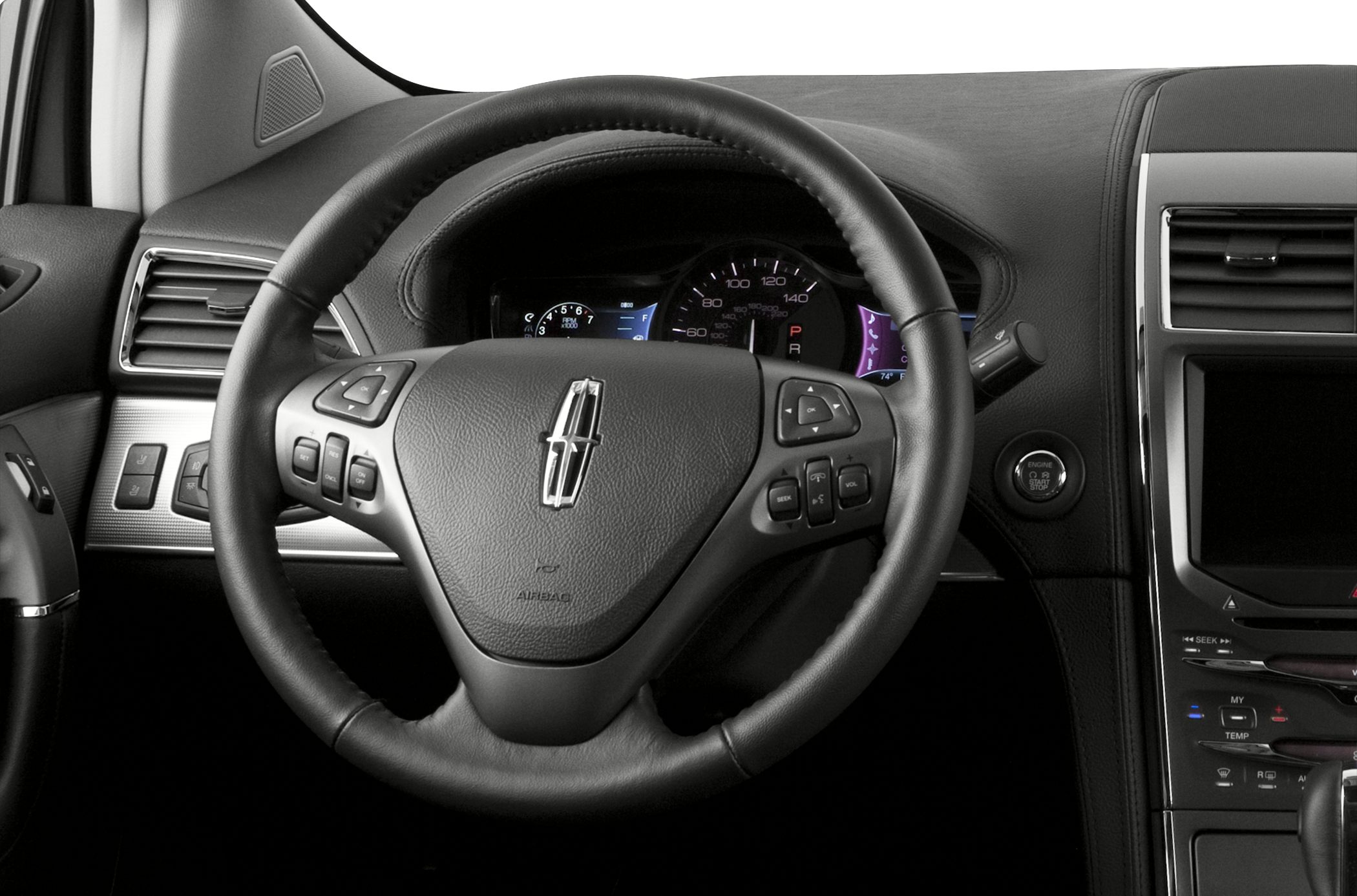 Steering wheel with control buttons and instrument cluster in car interior