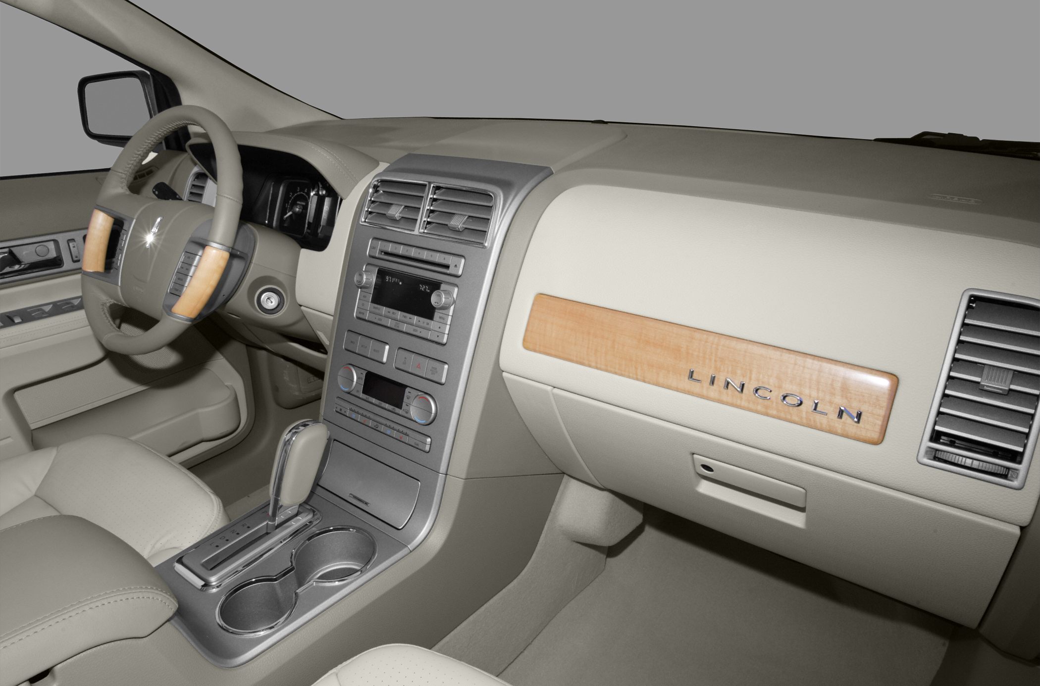 Leather steering wheel with wood trim and wood dashboard panel