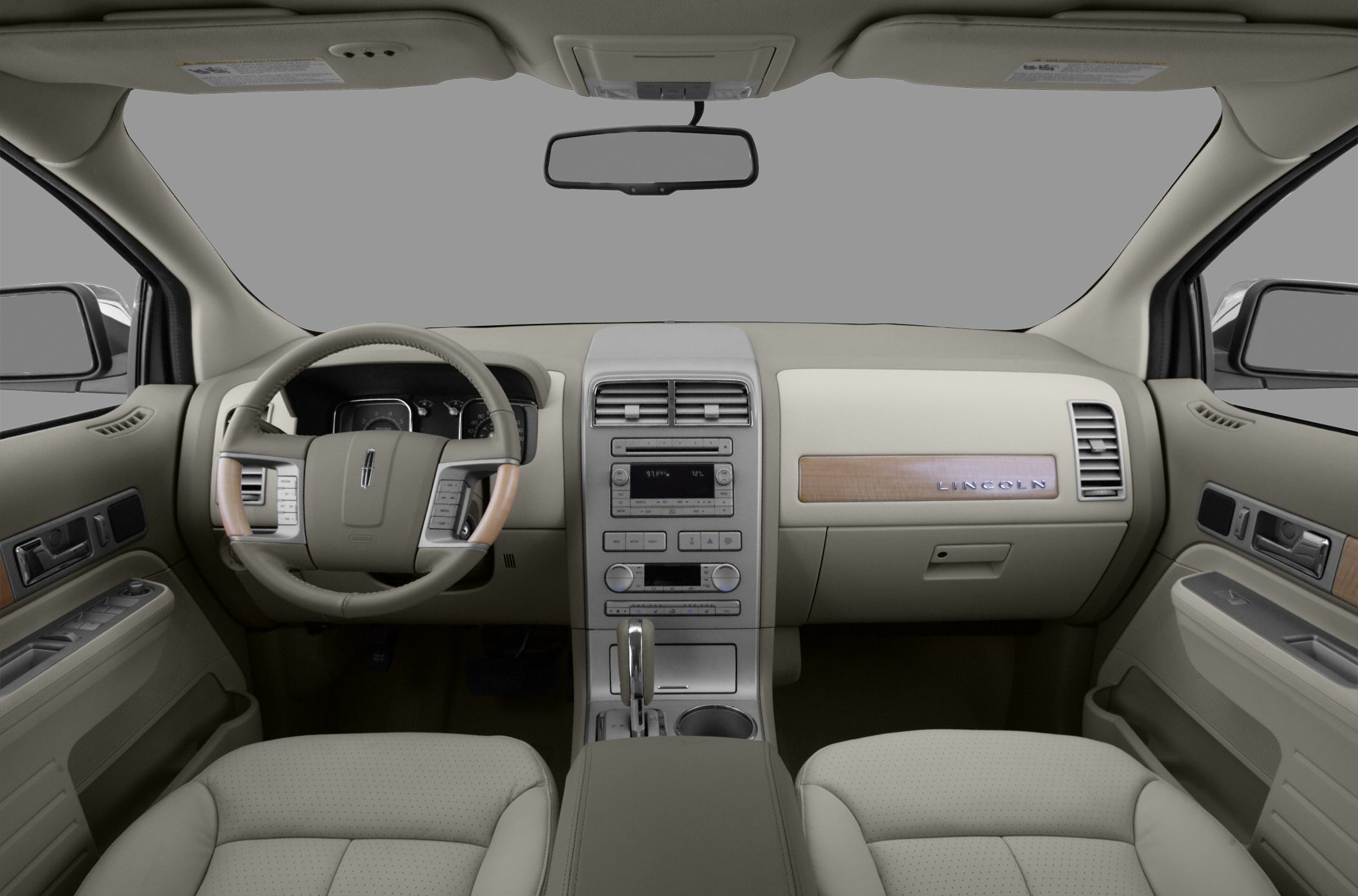 Beige leather interior with wood trim and modern steering wheel controls