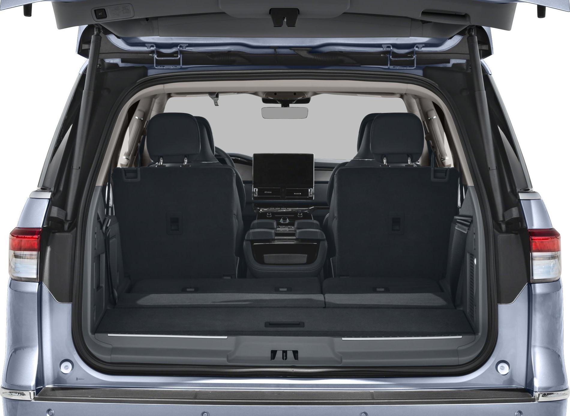 Spacious rear cargo area with folded seats and visible dashboard