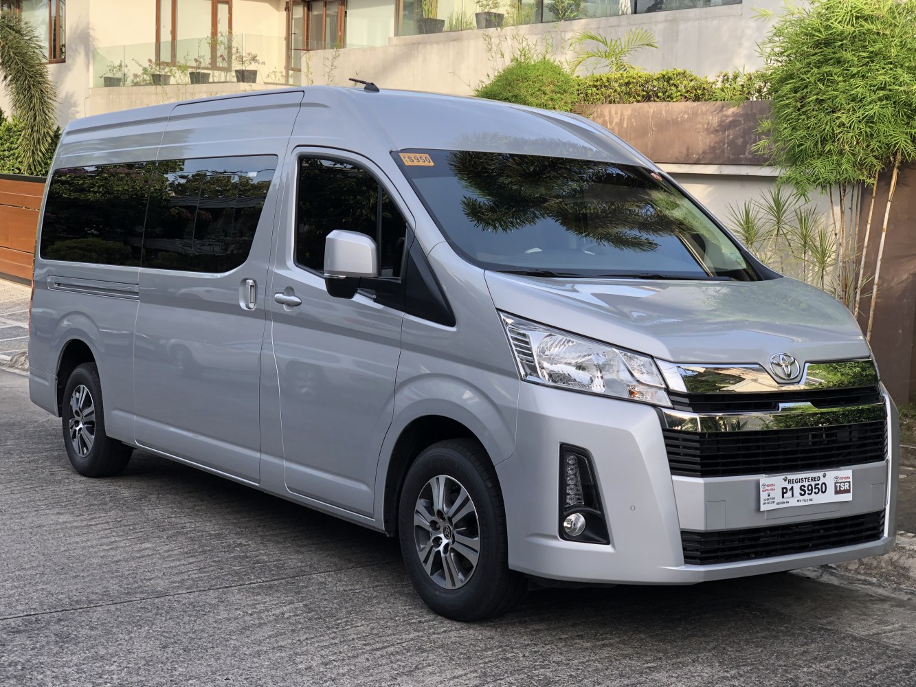 Silver long-wheelbase van with distinctive front grille and large side windows