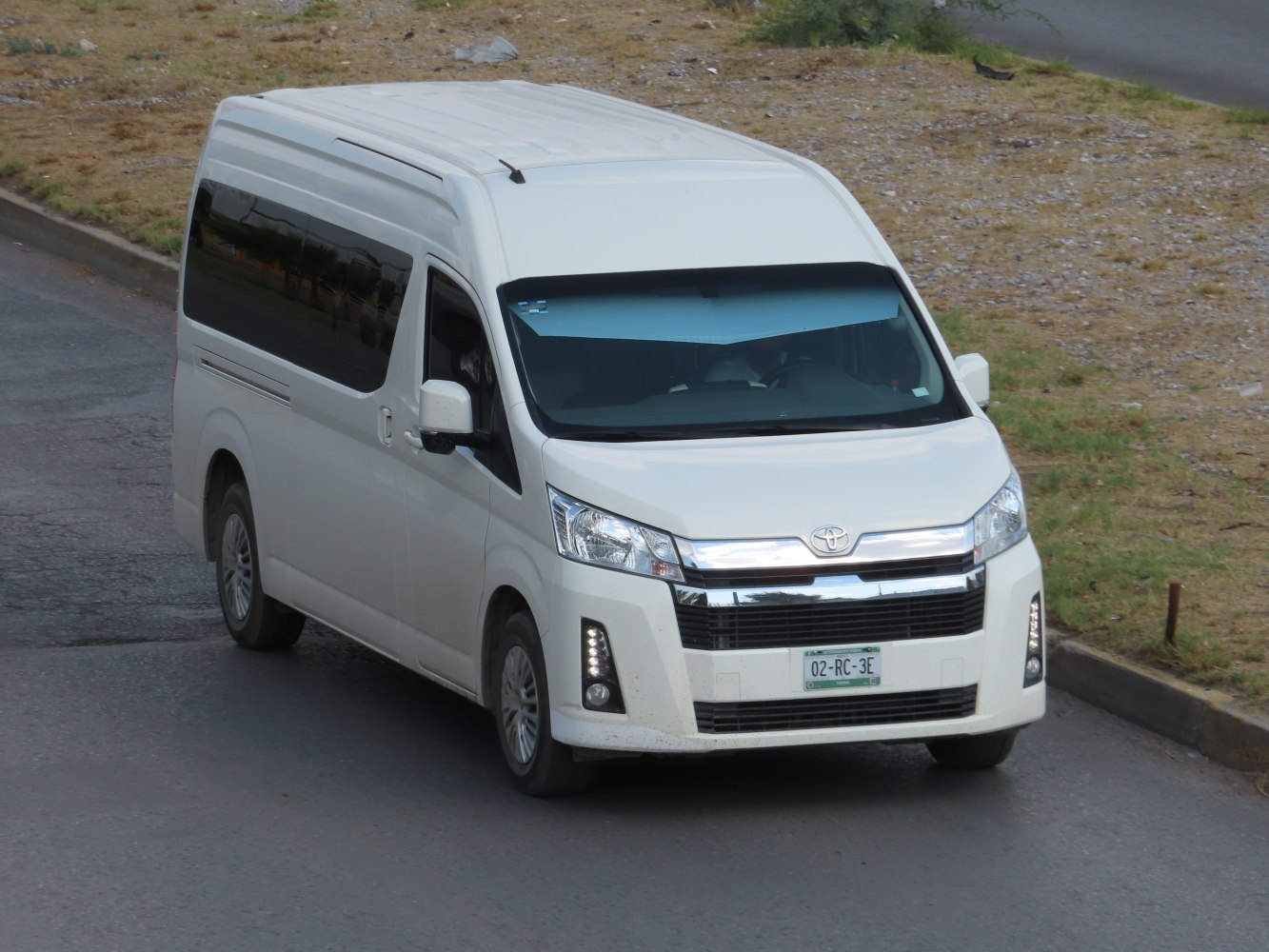 White van with large front grille and high roof