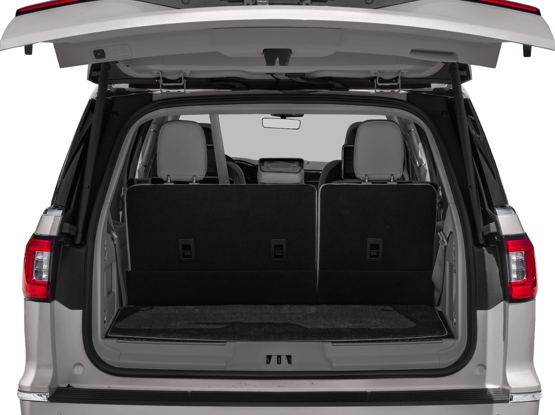 Open SUV rear cargo space with upright rear seats and open tailgate