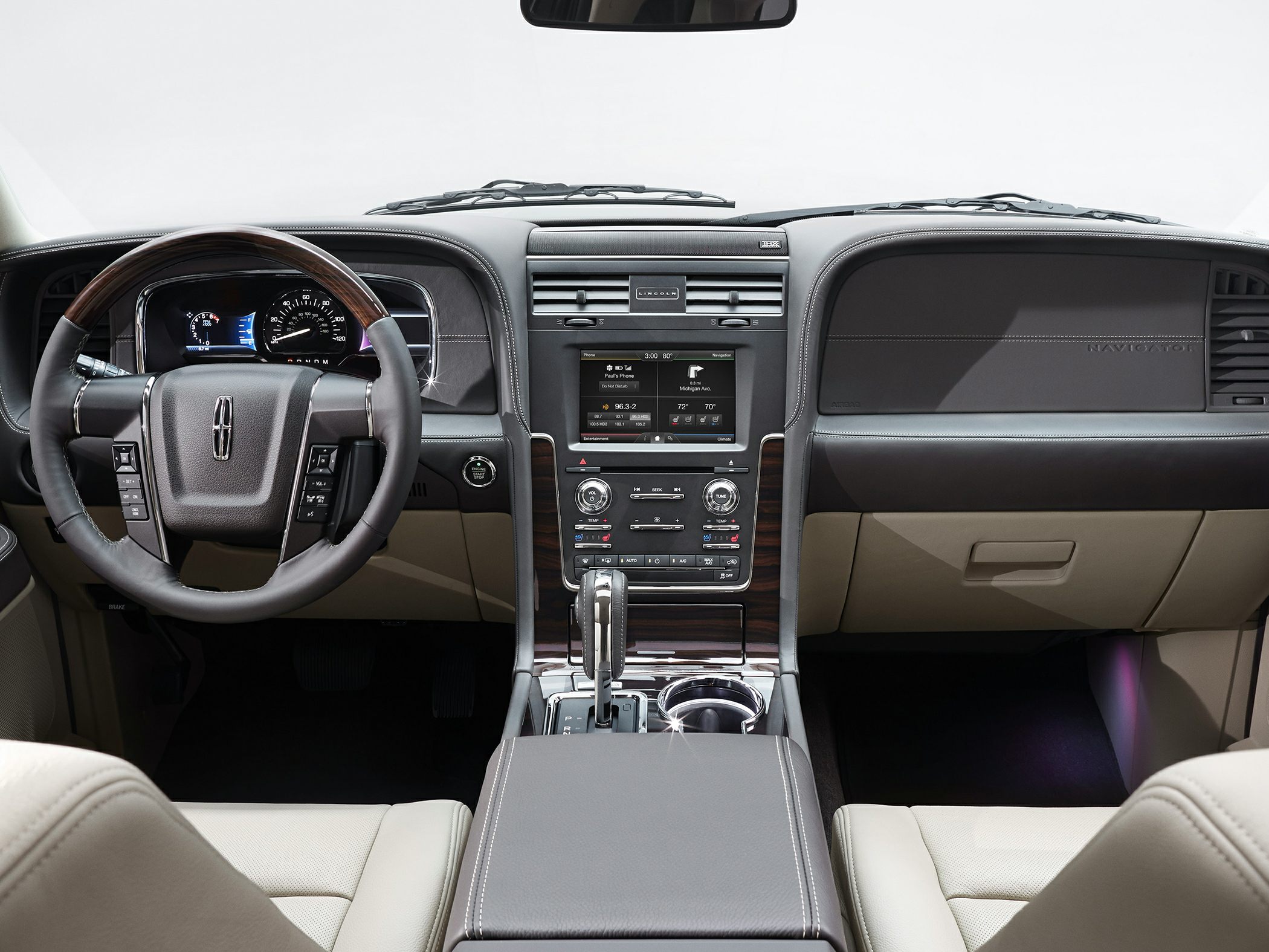 Luxury SUV interior dashboard with steering wheel and center console