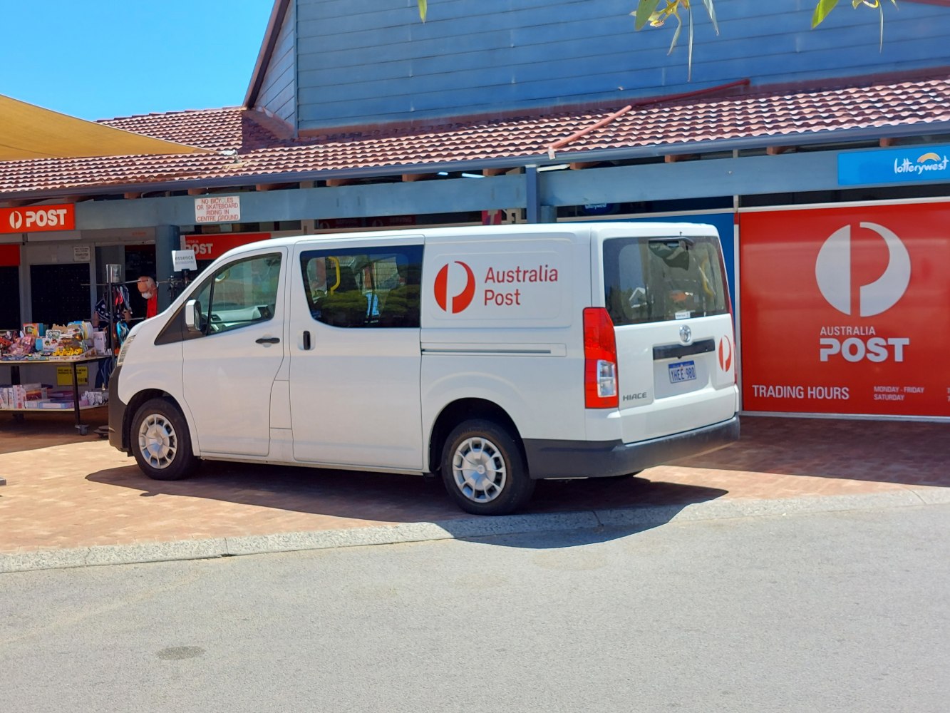 Side view of a white delivery van with Australia Post branding