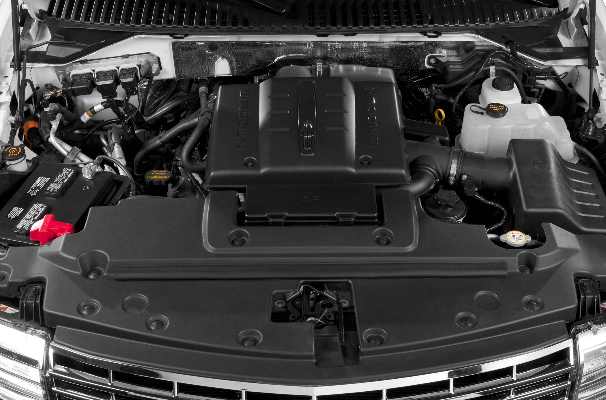 Engine bay with prominent engine cover and visible components