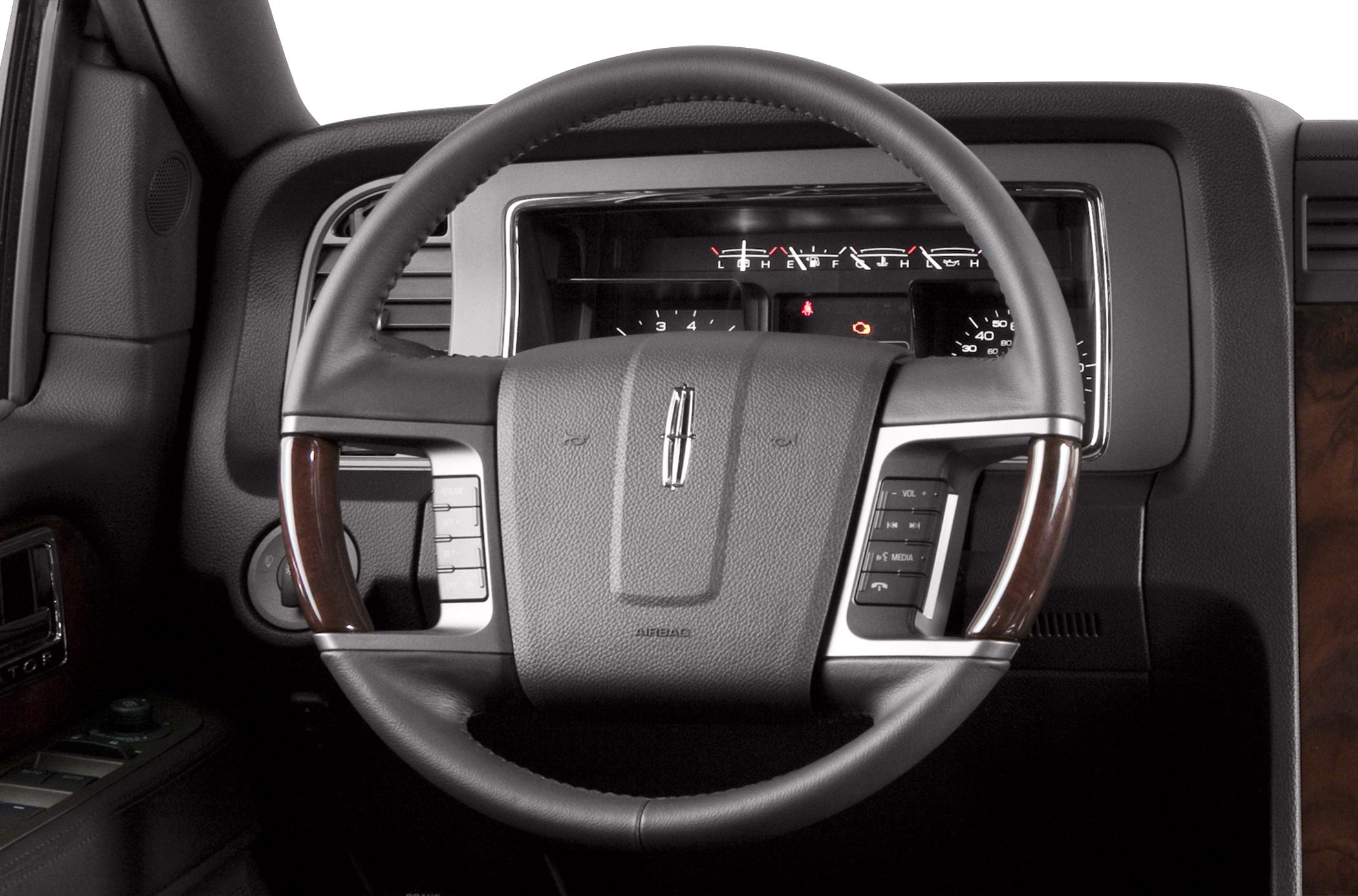 Steering wheel with wood trim and digital dashboard gauges