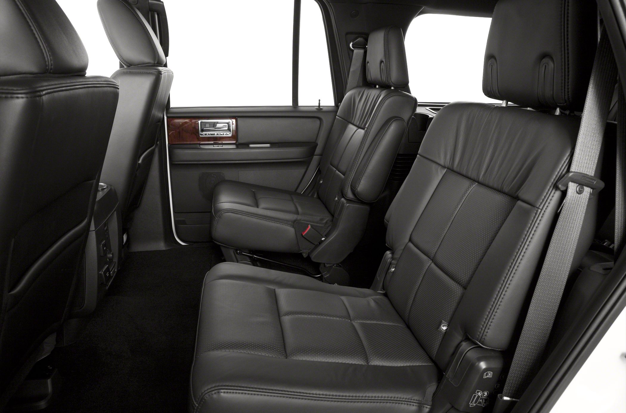 Rear premium black leather passenger seats with seat belts and detailed upholstery
