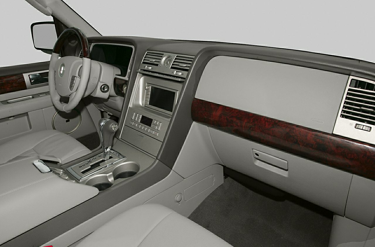 Dashboard and center console with wood trim and gear selector