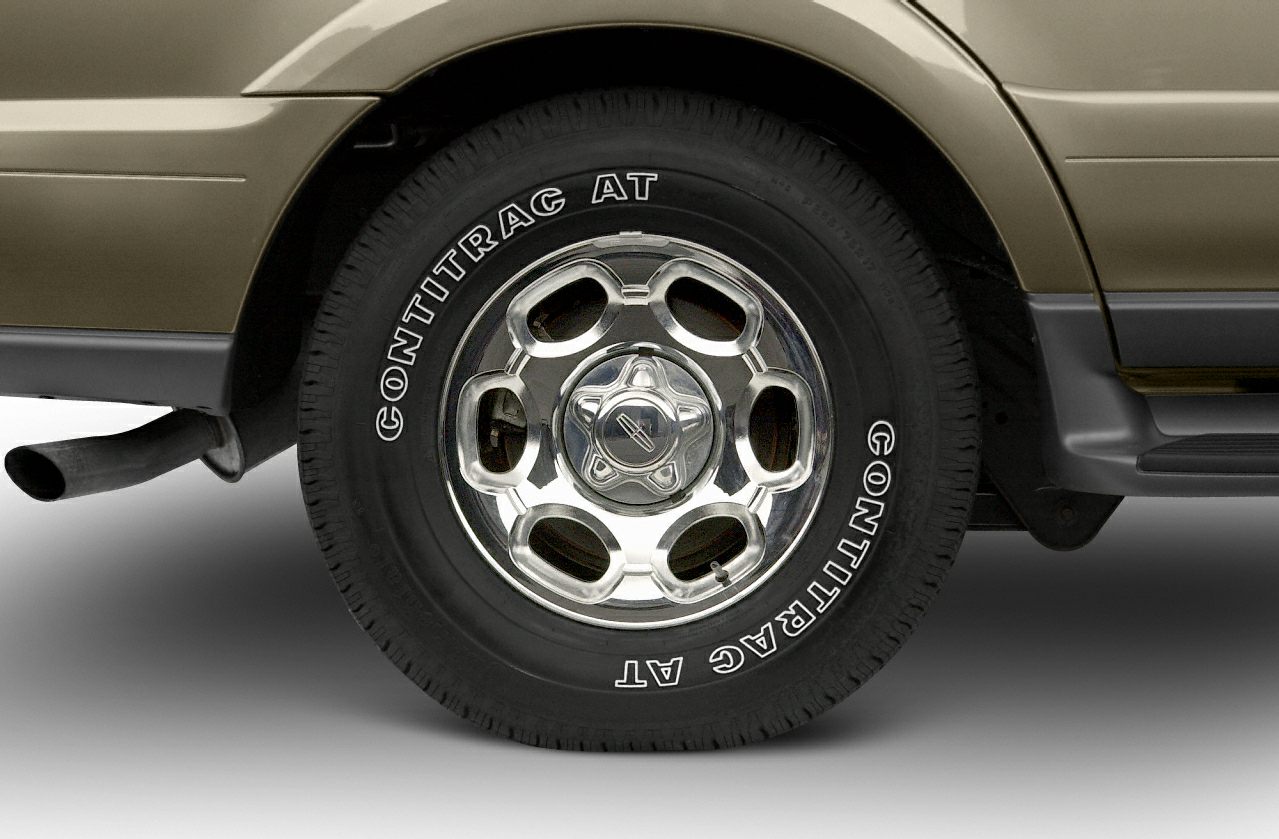 Close-up of chrome rim with ContiTrac AT tire on SUV