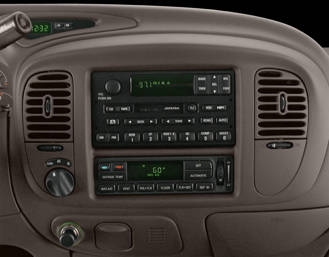 Radio and climate control panel with analog buttons and digital temperature display