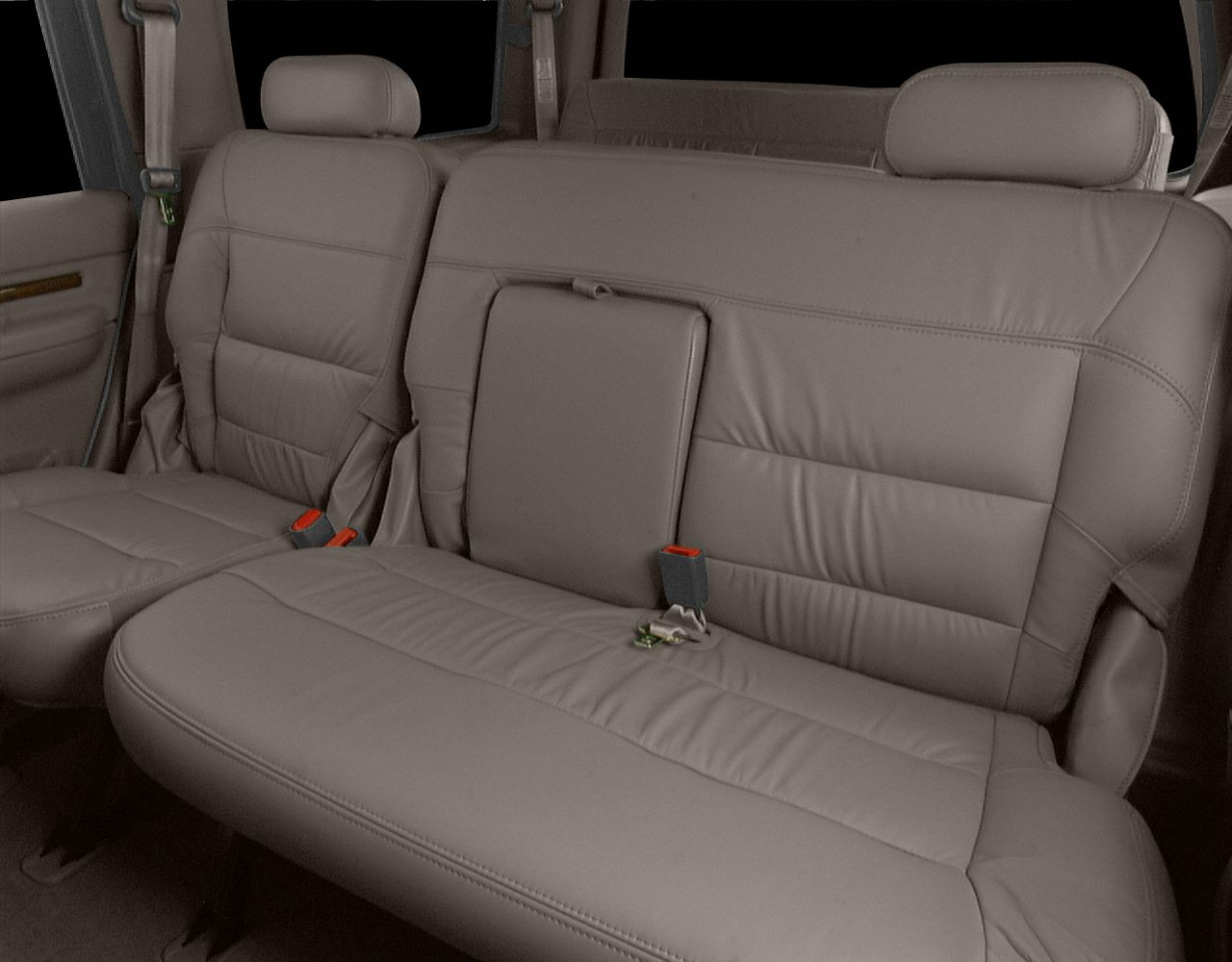 Leather rear seats with armrest and seat belts in a spacious SUV interior