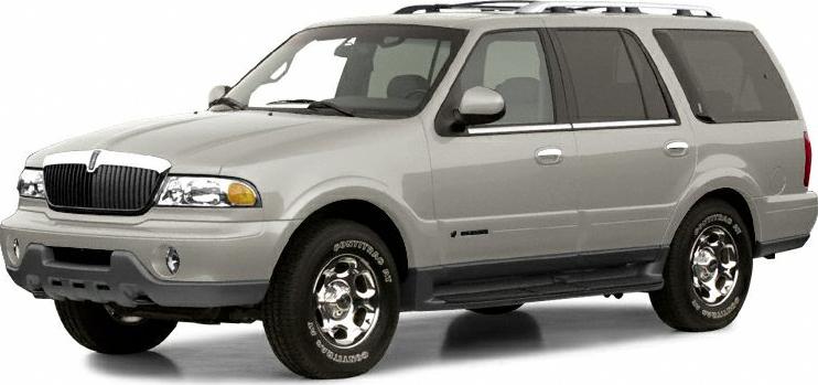Front side view of a silver SUV with rugged body and classic design