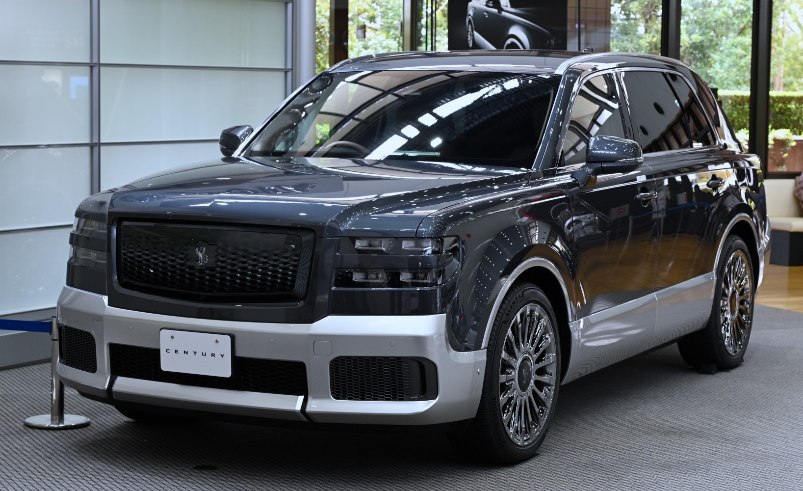 Luxury SUV with bold black grille and chrome wheels