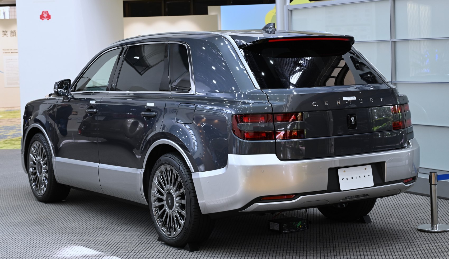 Rear-side view of luxury SUV with two-tone paint and tinted windows