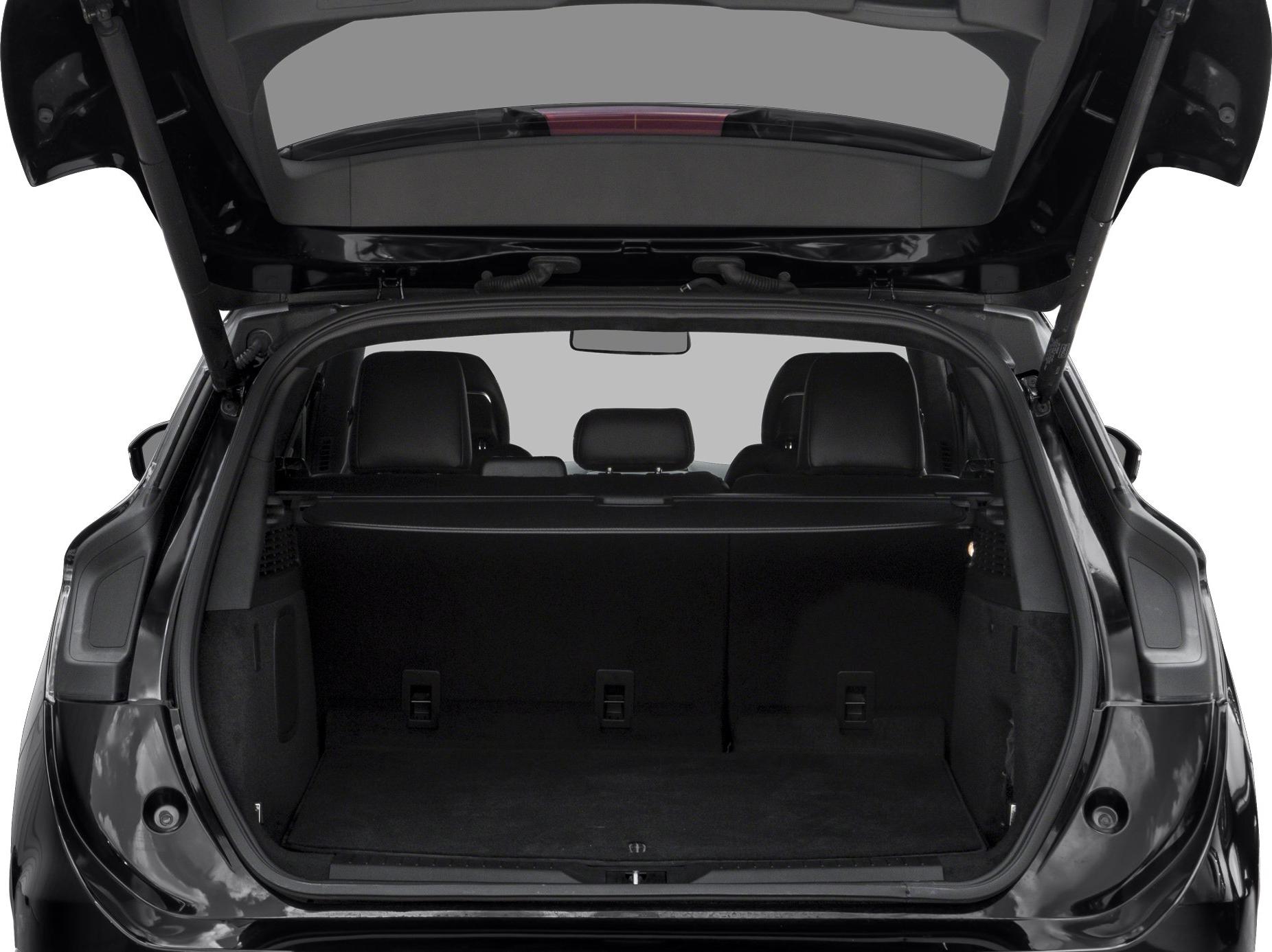 Open trunk with spacious cargo area and foldable rear seats in black interior