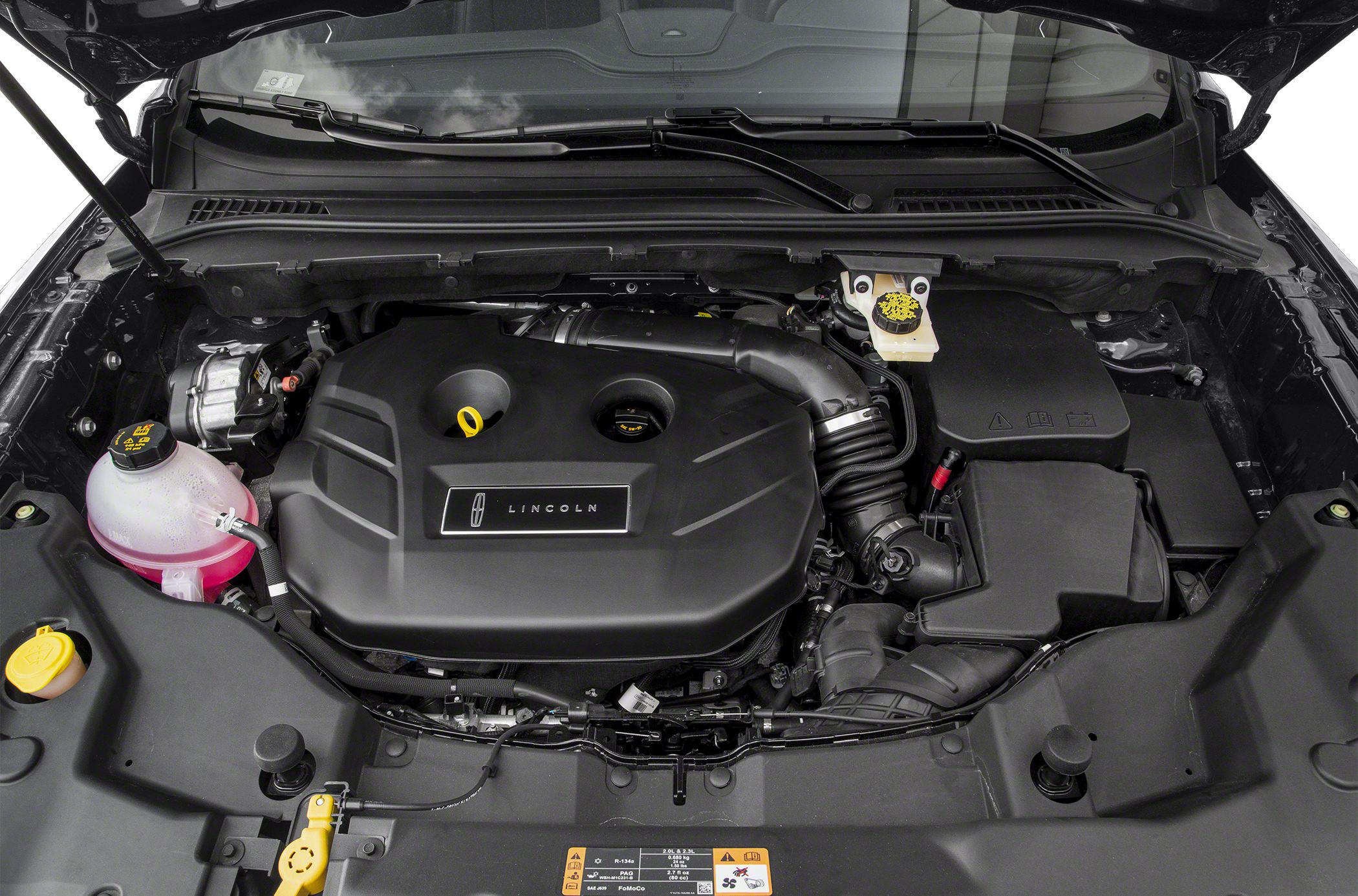 Engine bay with Lincoln-branded cover and fluid reservoirs