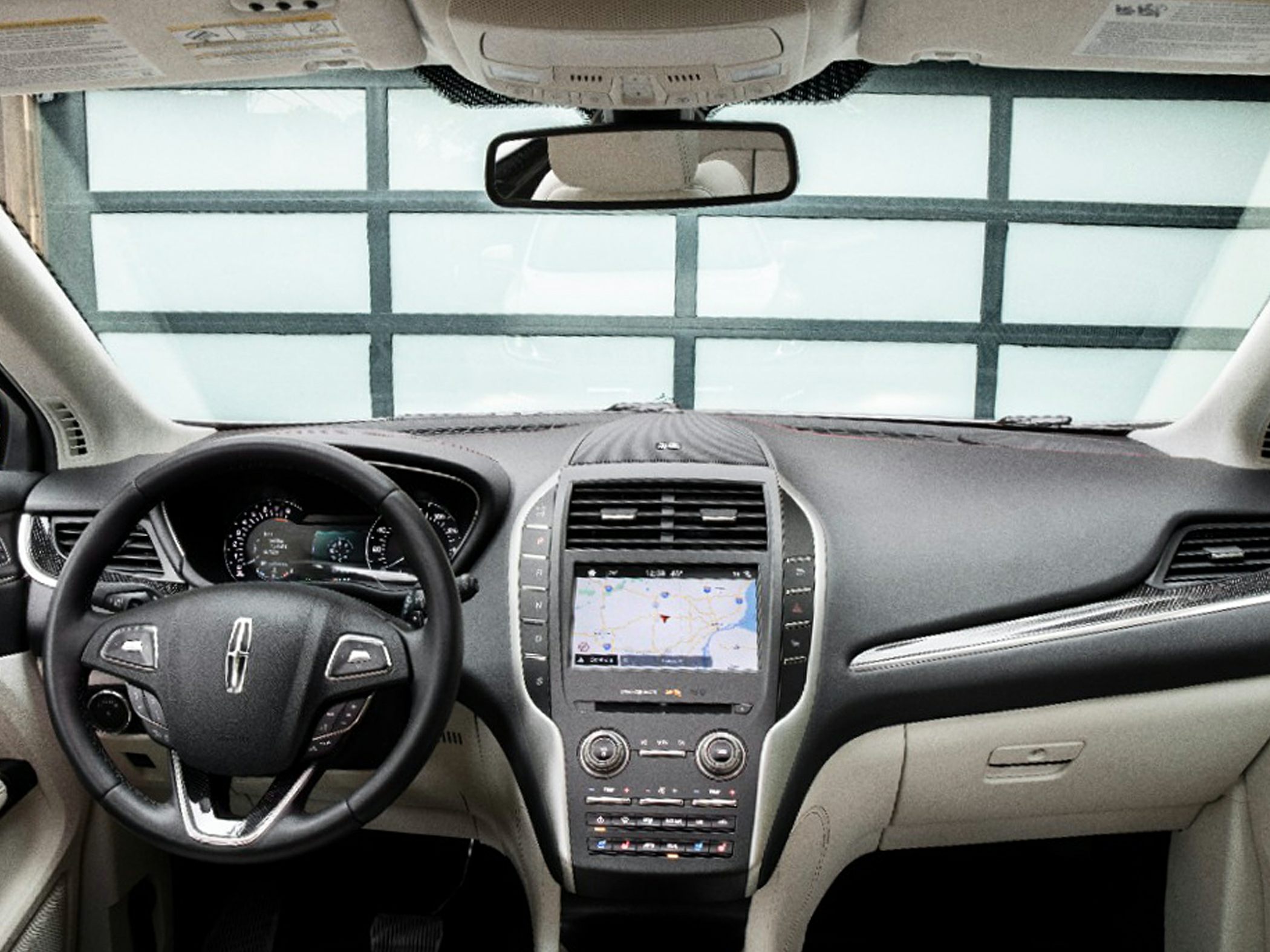 Modern dashboard with touchscreen navigation and multi-function steering wheel