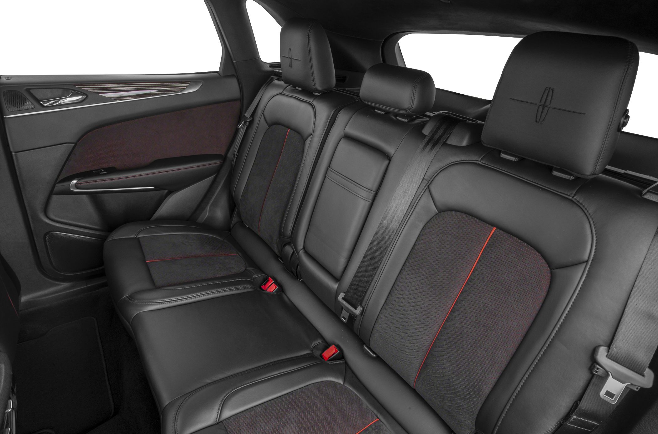 Rear black leather seats with red stitching and signature logos in a luxury vehicle.