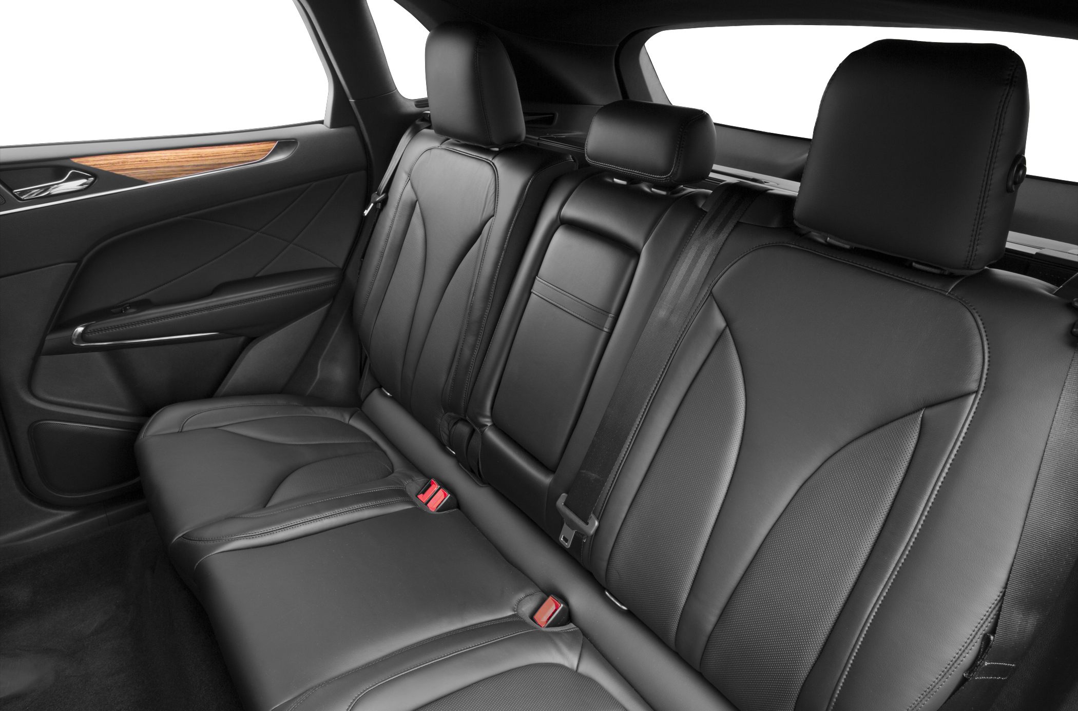 Black leather rear seats with headrests and a wood-trimmed door panel.