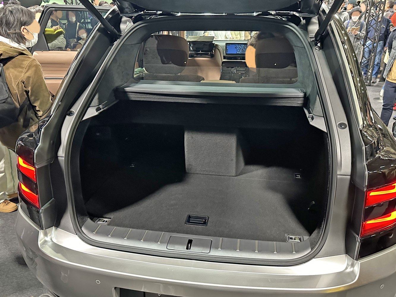 Spacious rear trunk interior of luxury SUV with rear seat view