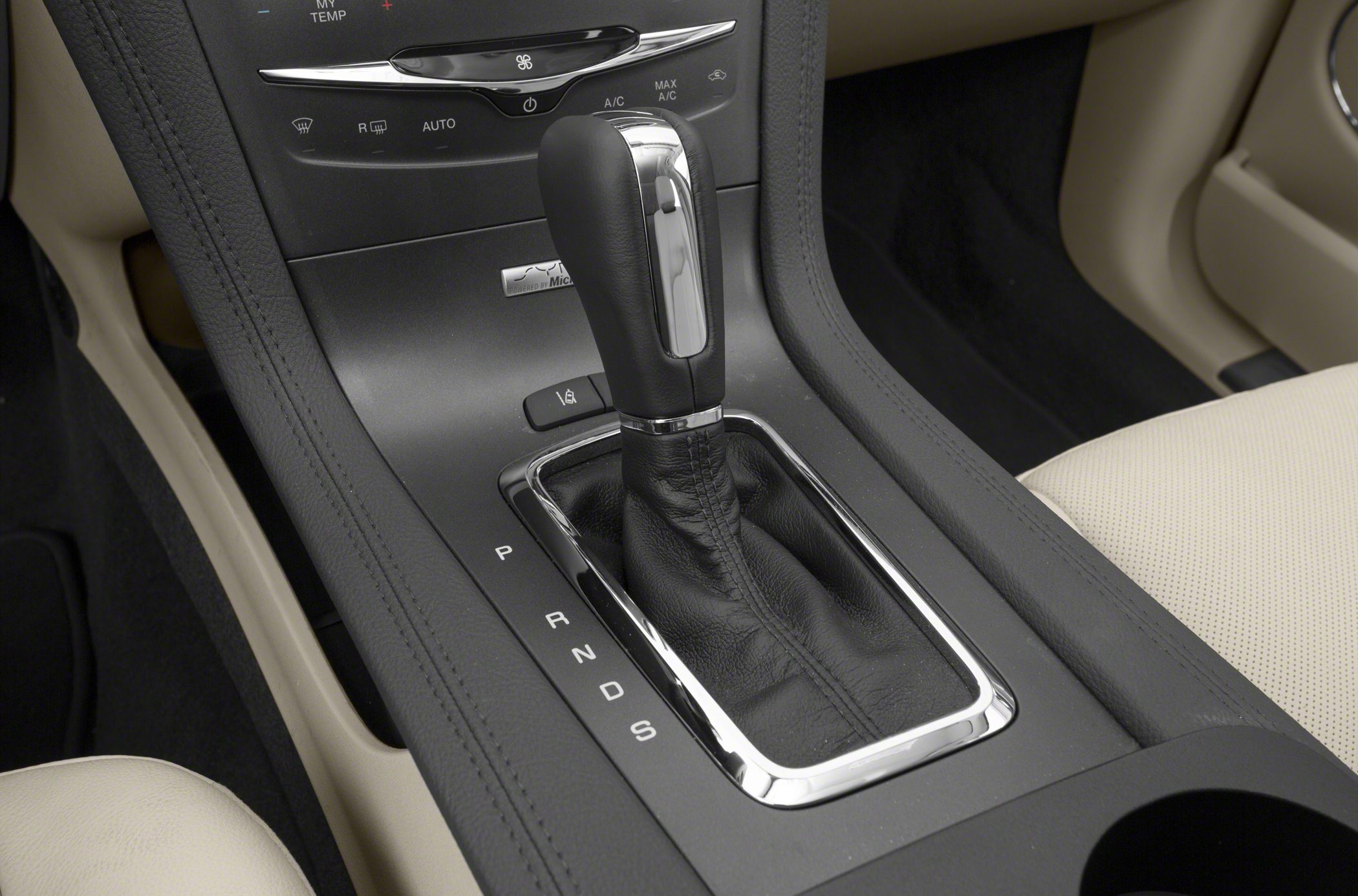 Automatic gear shifter with leather boot and chrome trim in center console