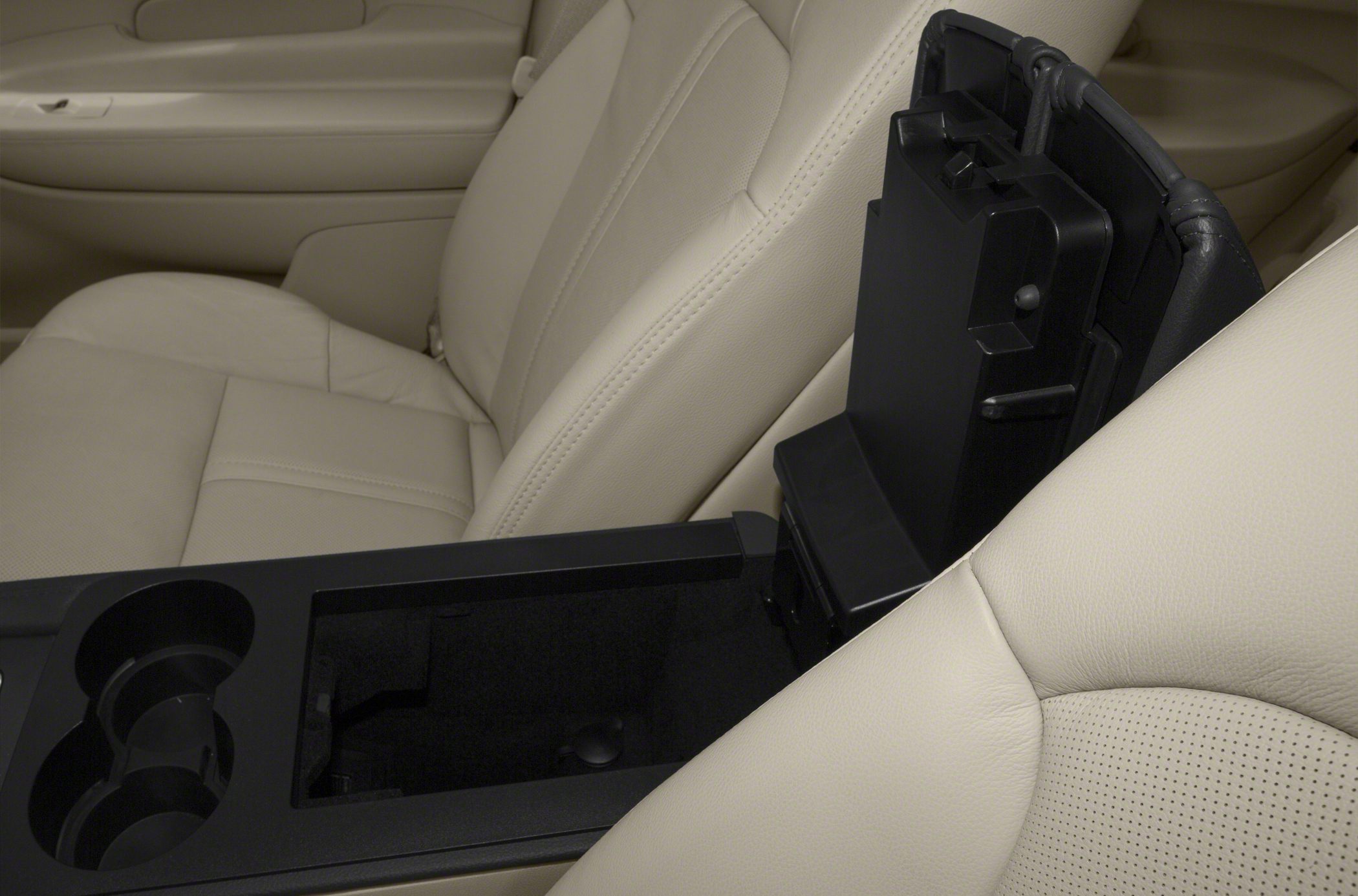 Beige leather seats with spacious center console storage and dual cup holders