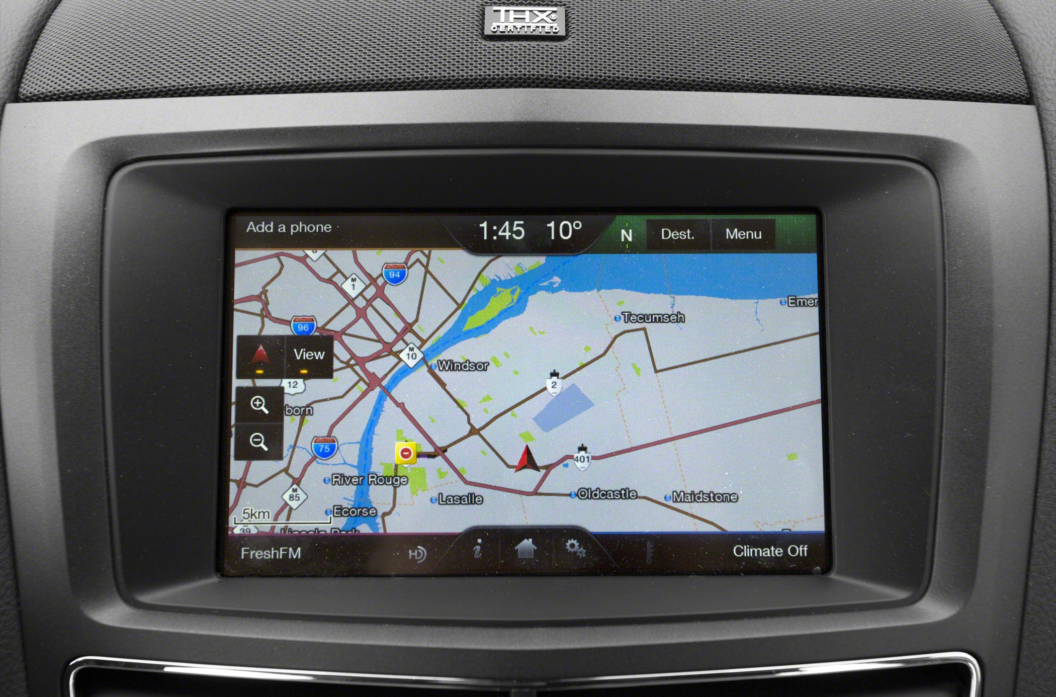In-car navigation system screen with map and route details.