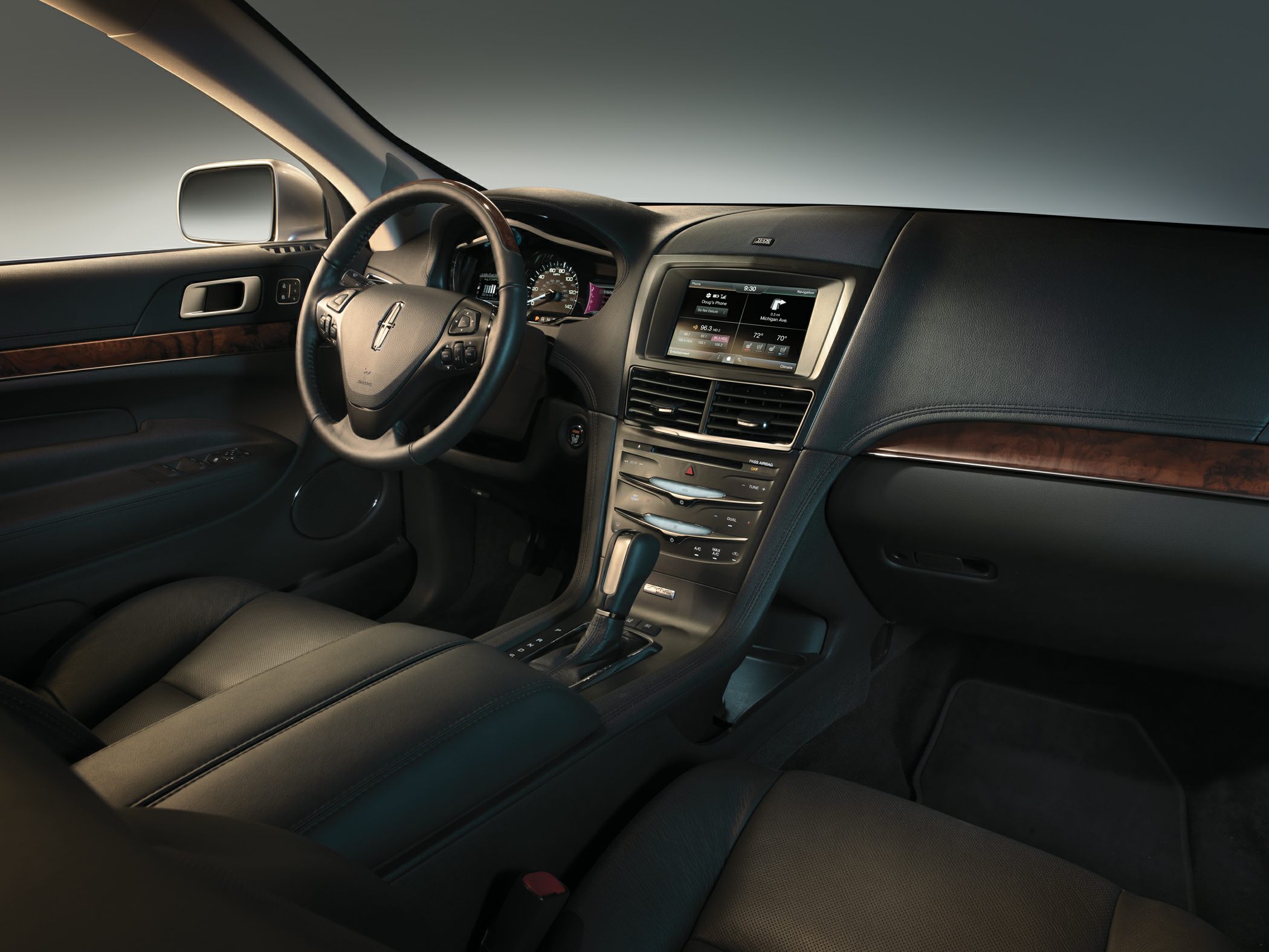 Luxury leather interior with wood trim and infotainment screen