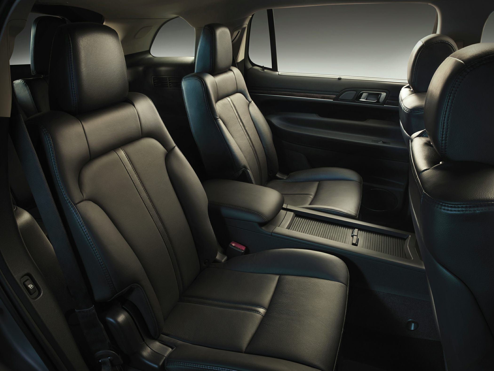 Black leather rear seats with armrest console and spacious layout