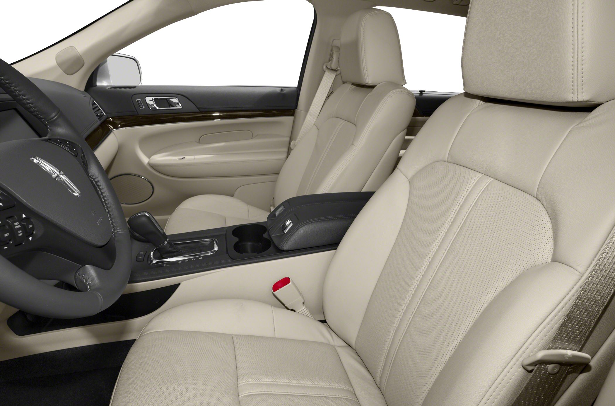 Beige leather seats and modern center console with armrest.