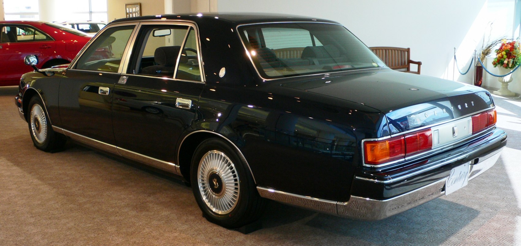 Luxury sedan rear with chrome trim and distinctive taillights
