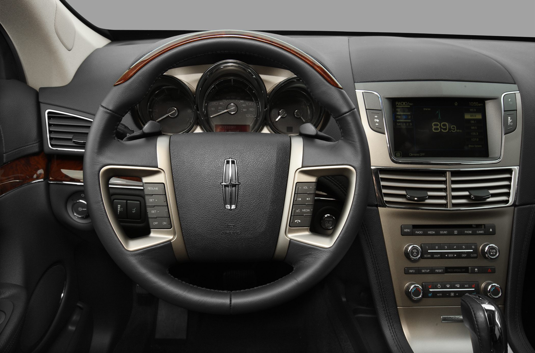Luxury steering wheel with instrument cluster and center console controls