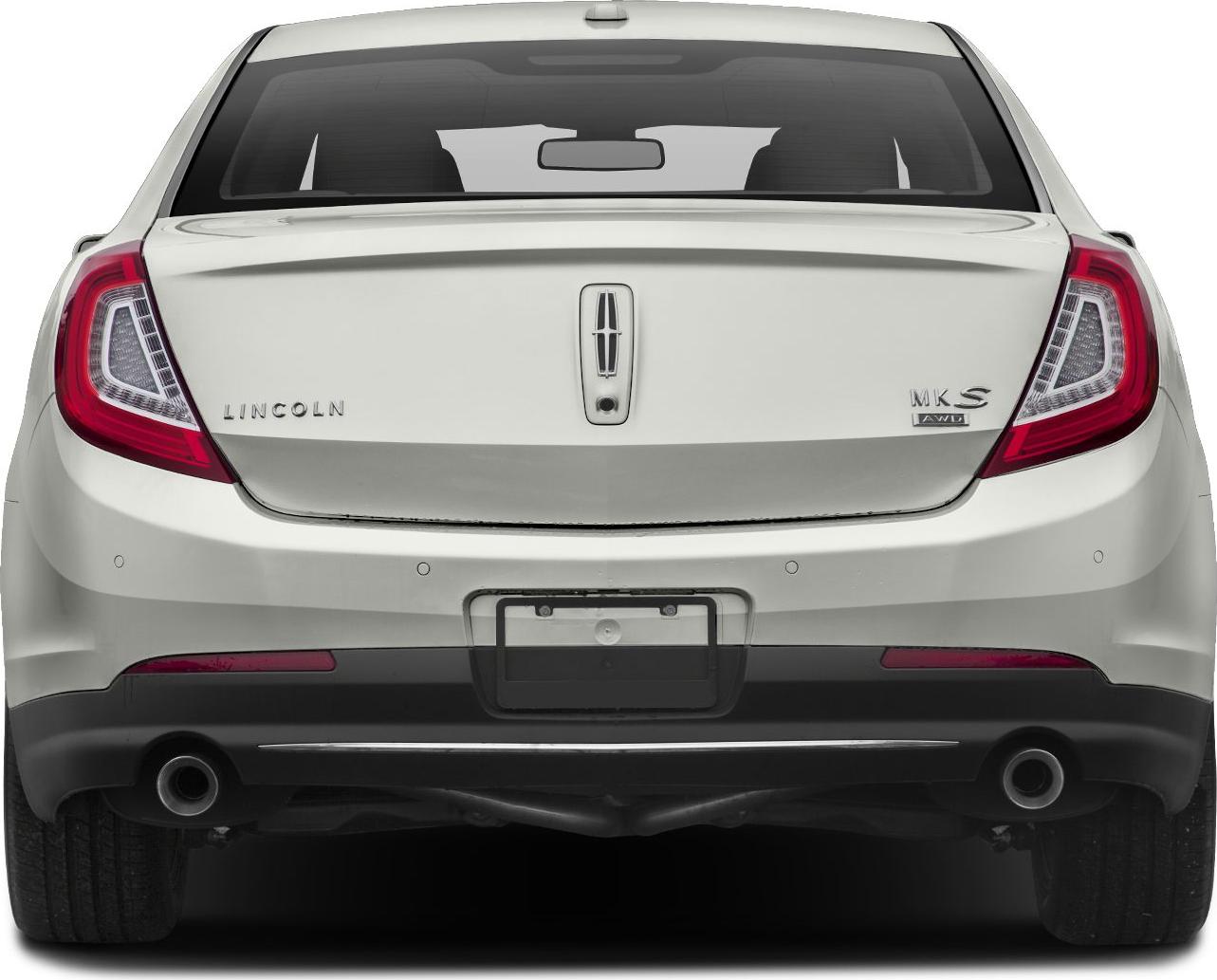 Rear view with tail lights, dual exhaust, trunk, and license plate area