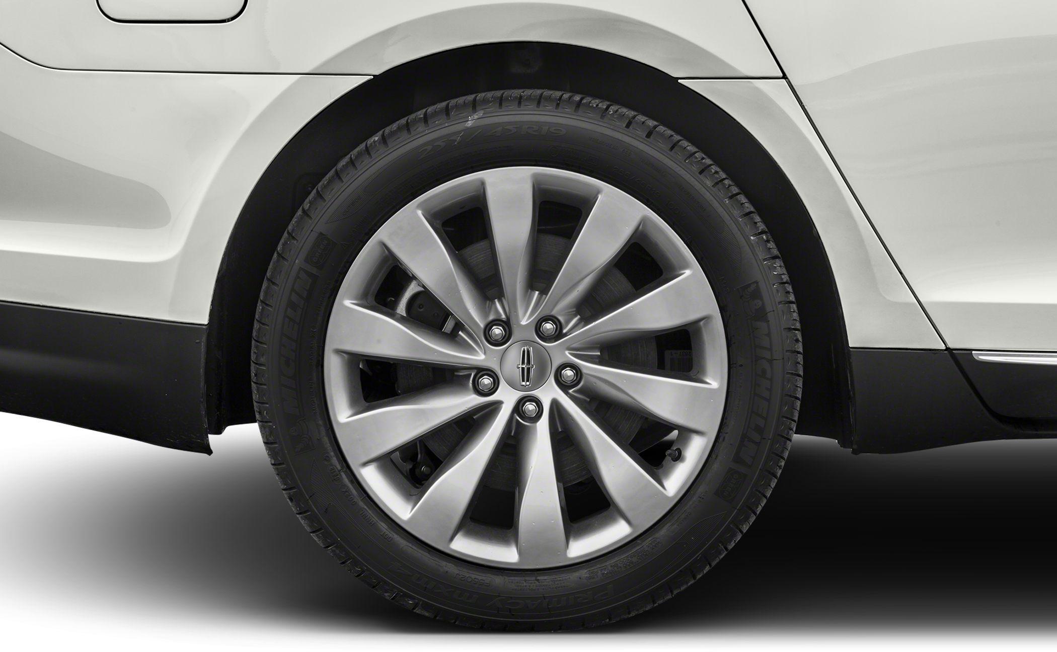 Close-up of alloy wheel and tire with Lincoln emblem