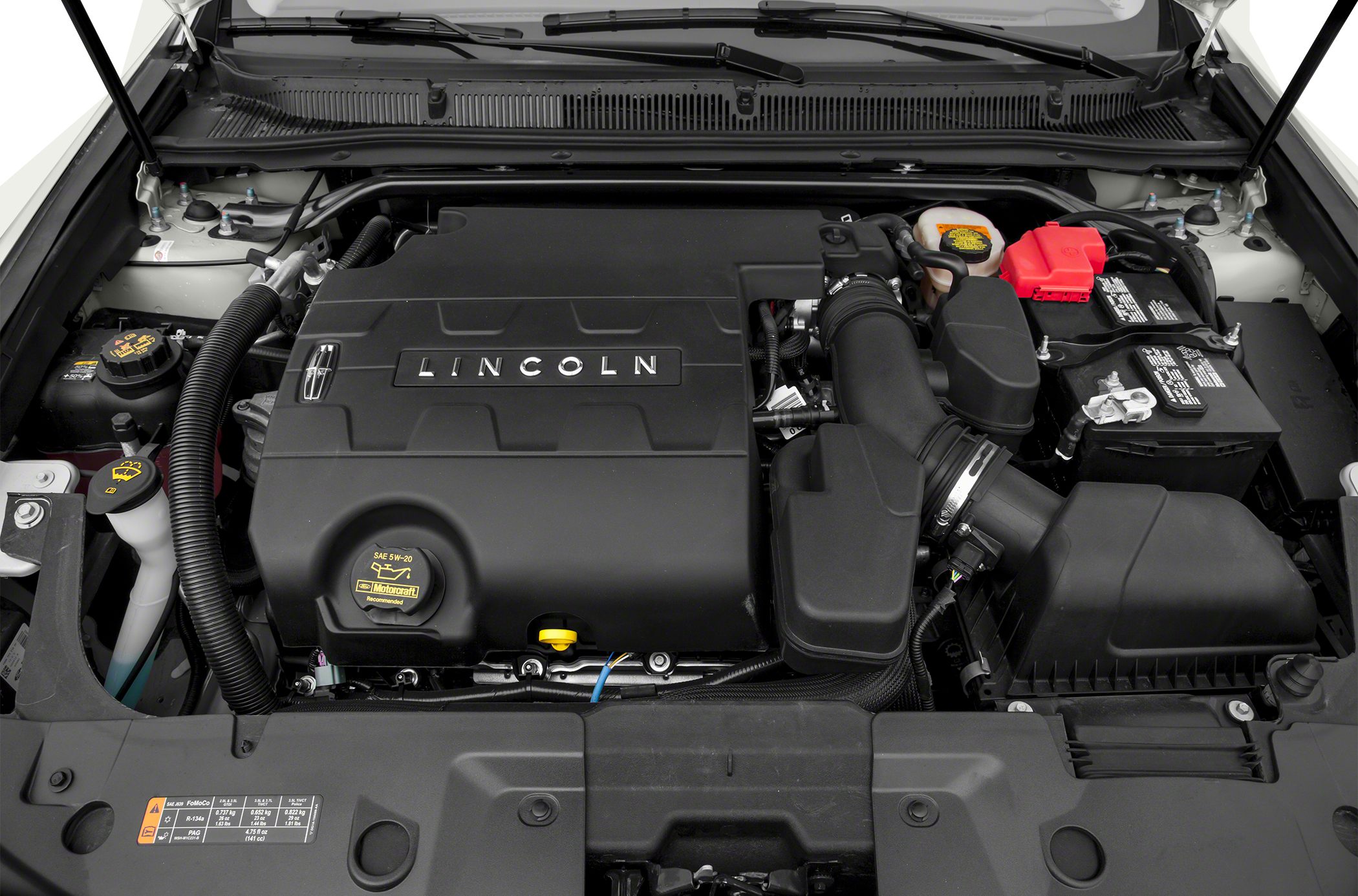 Engine bay with Lincoln-branded engine cover and components.