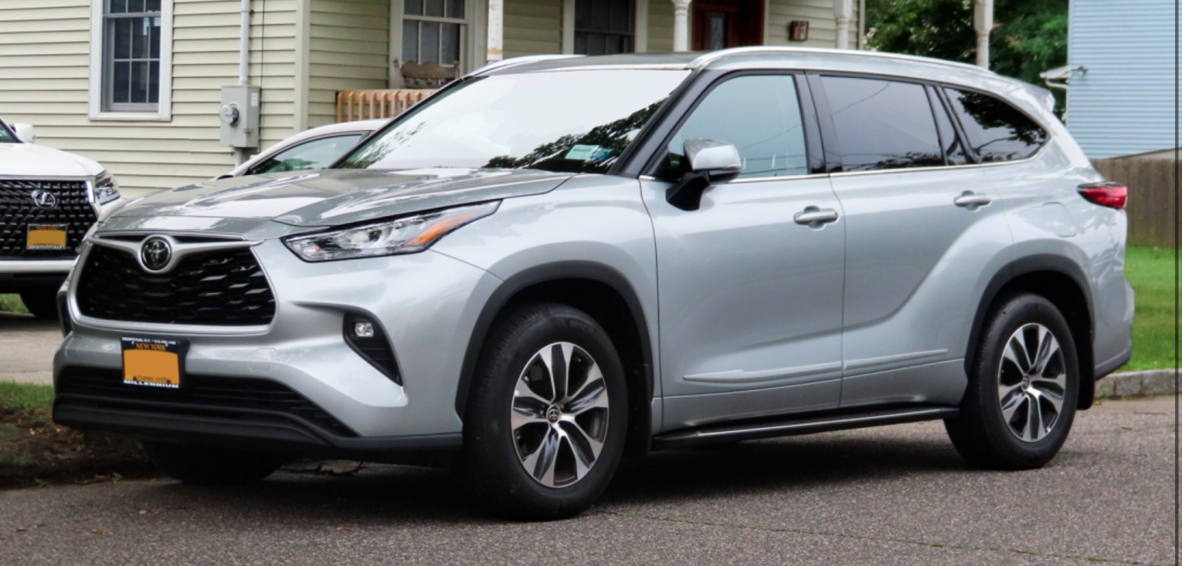 Front side view of silver SUV with alloy wheels and modern design