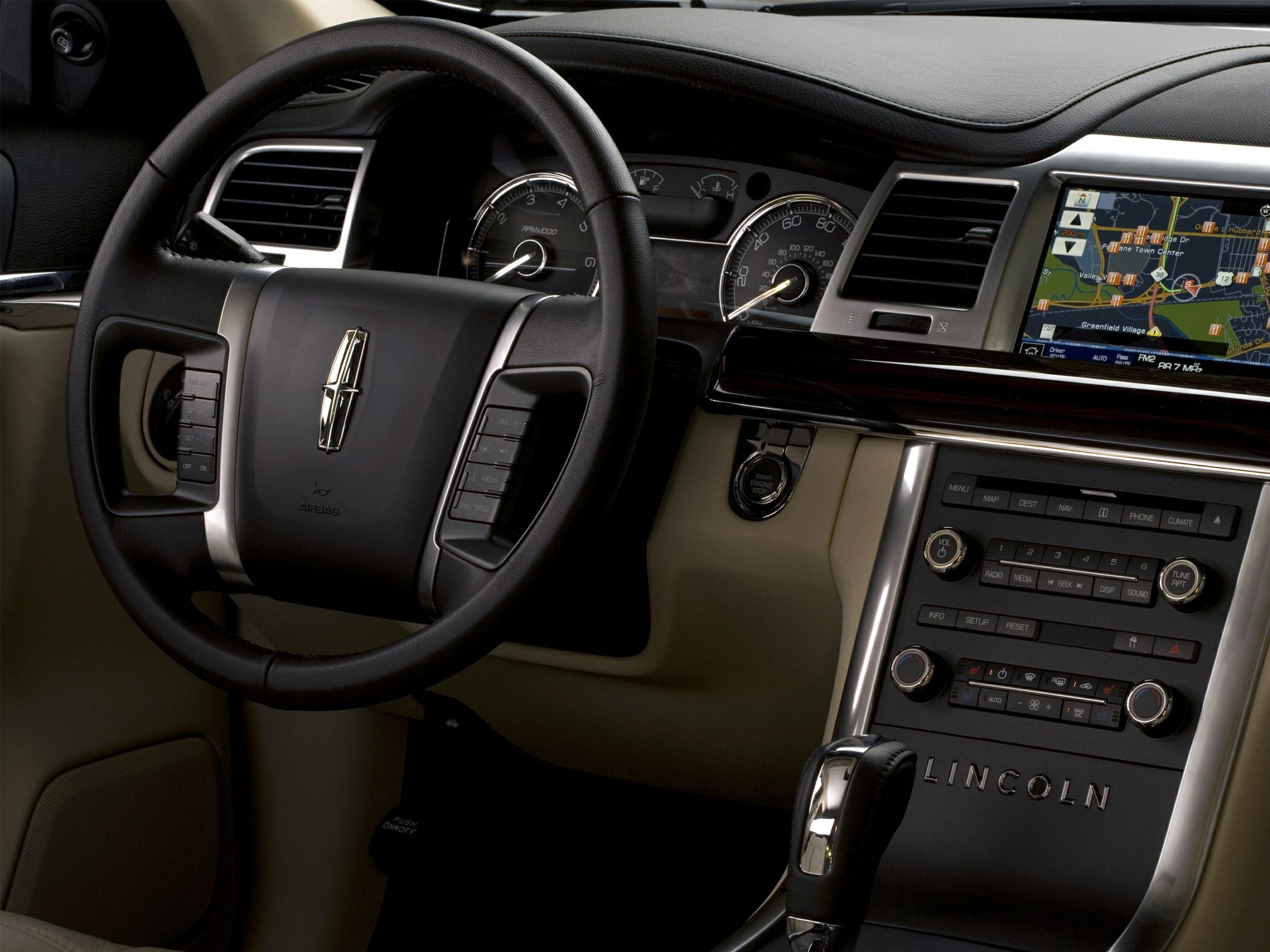 Luxury leather steering wheel with infotainment screen and dashboard controls
