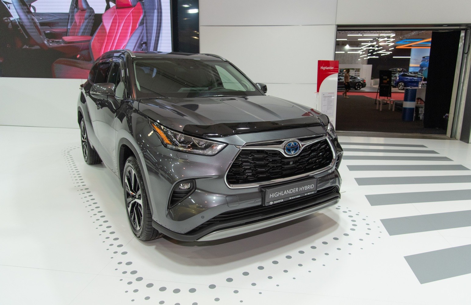 Front view of hybrid SUV with bold grille and LED headlights