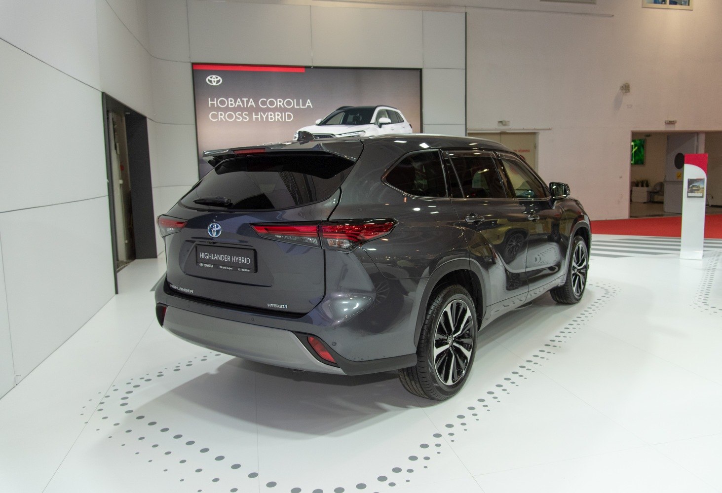 Rear and side view of hybrid SUV with sleek design and modern wheels.