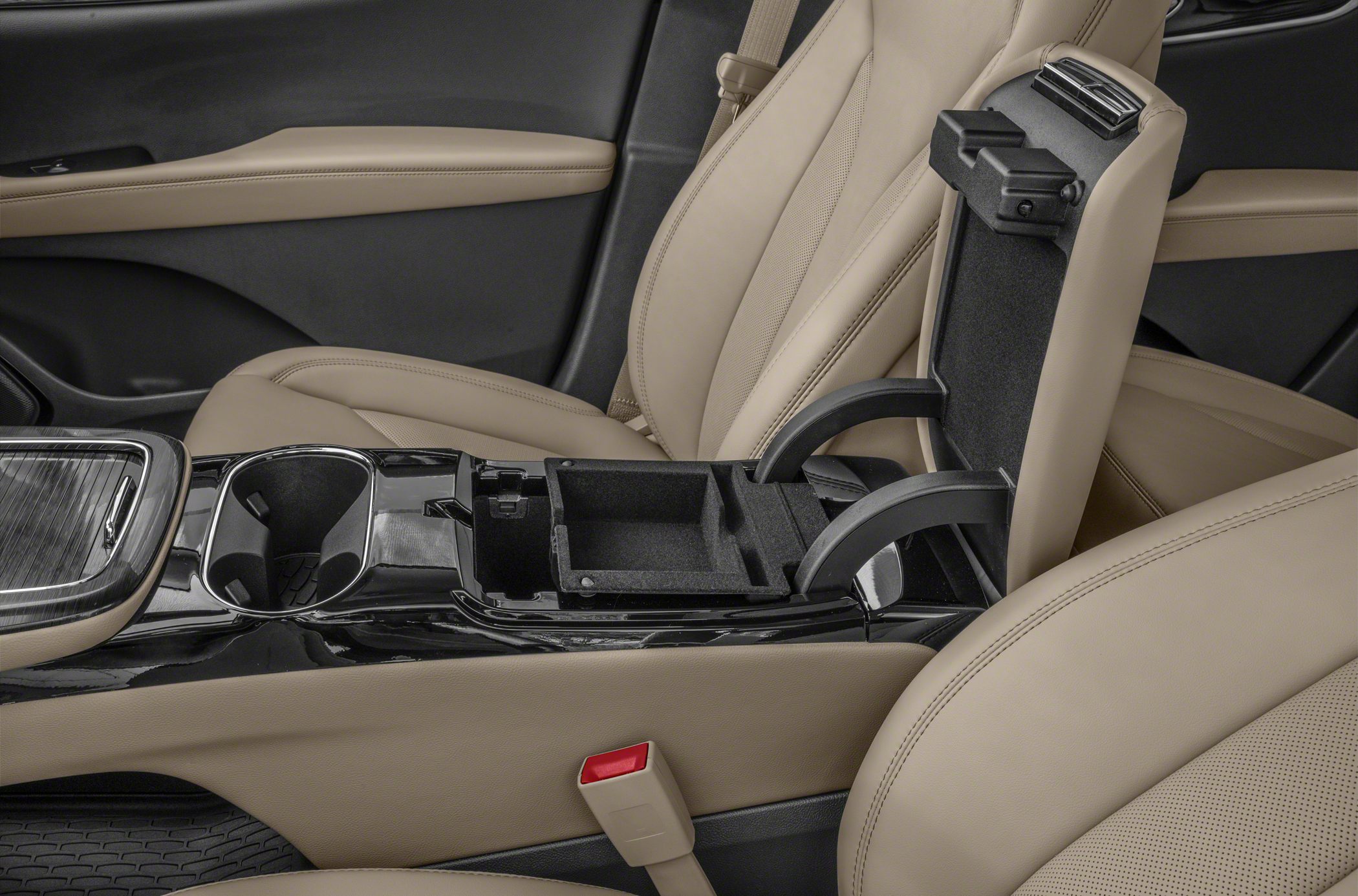 Central console storage compartment and dual cup holders in beige interior