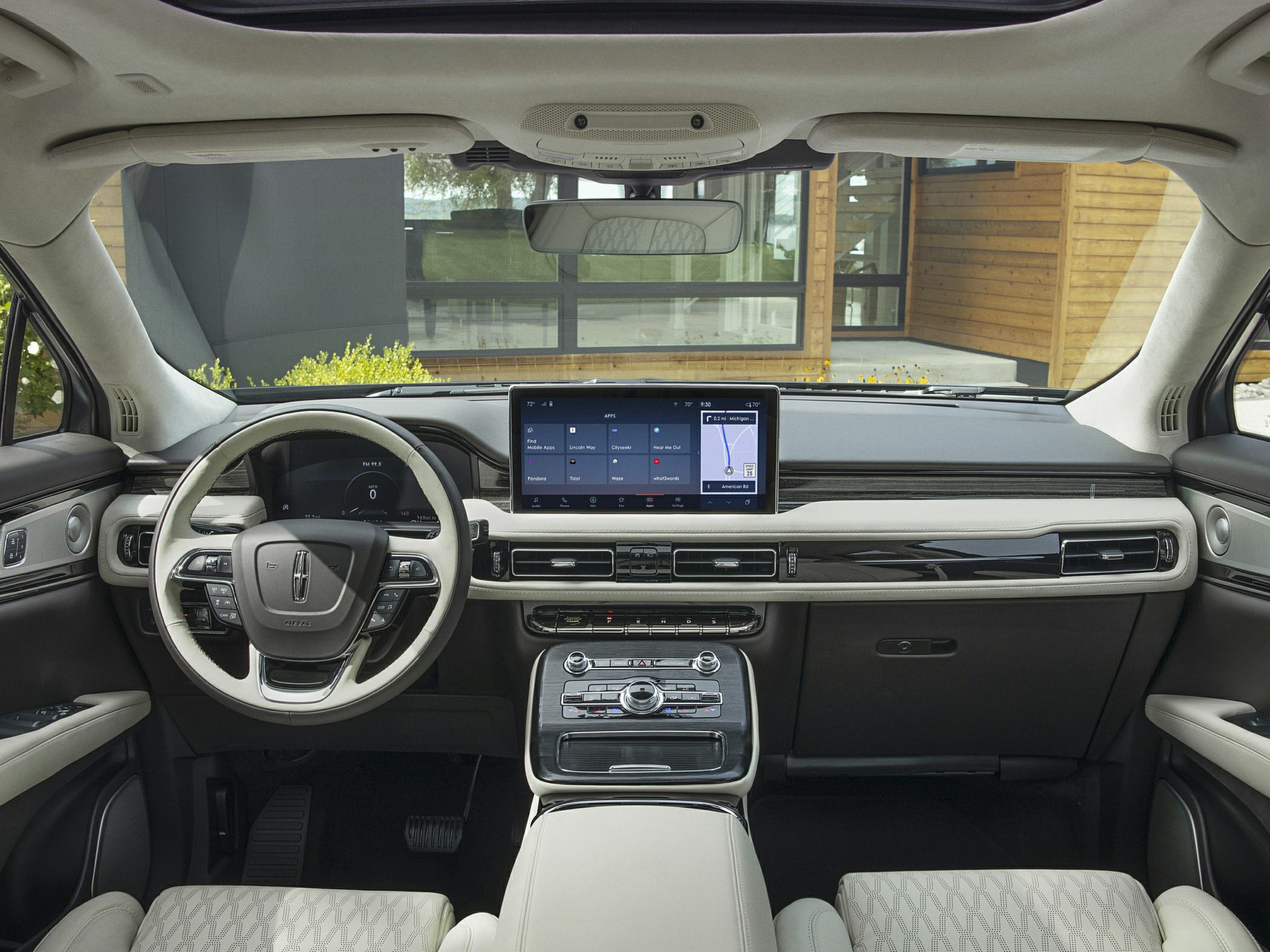 Luxury steering wheel with multi-function controls and large digital dashboard display