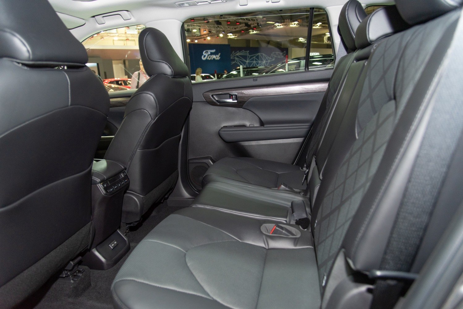 Spacious rear seat with black leather upholstery and comfort features