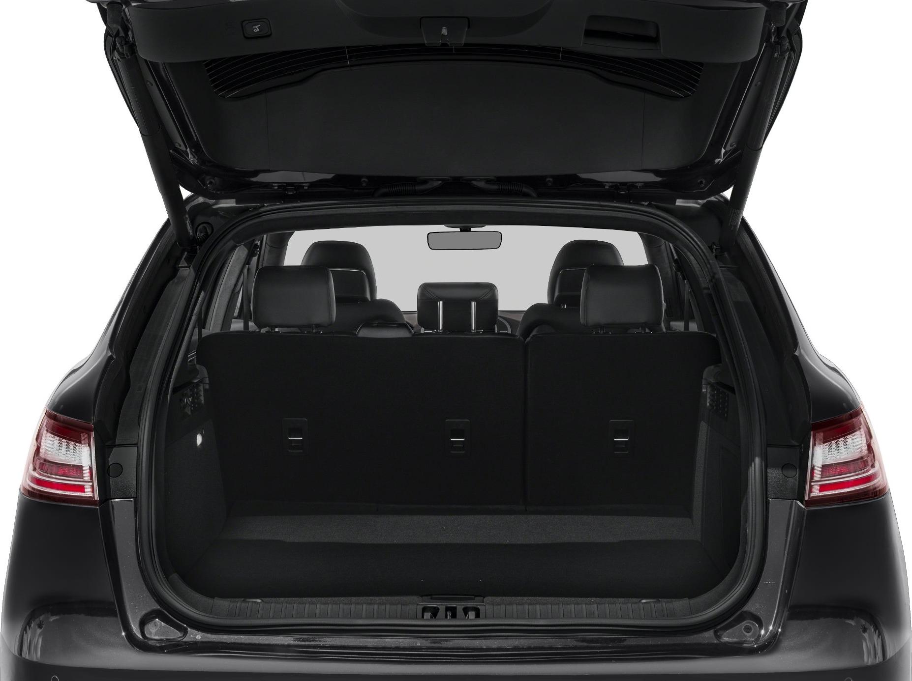 Open rear hatch showing spacious black interior cargo area with folded seats.