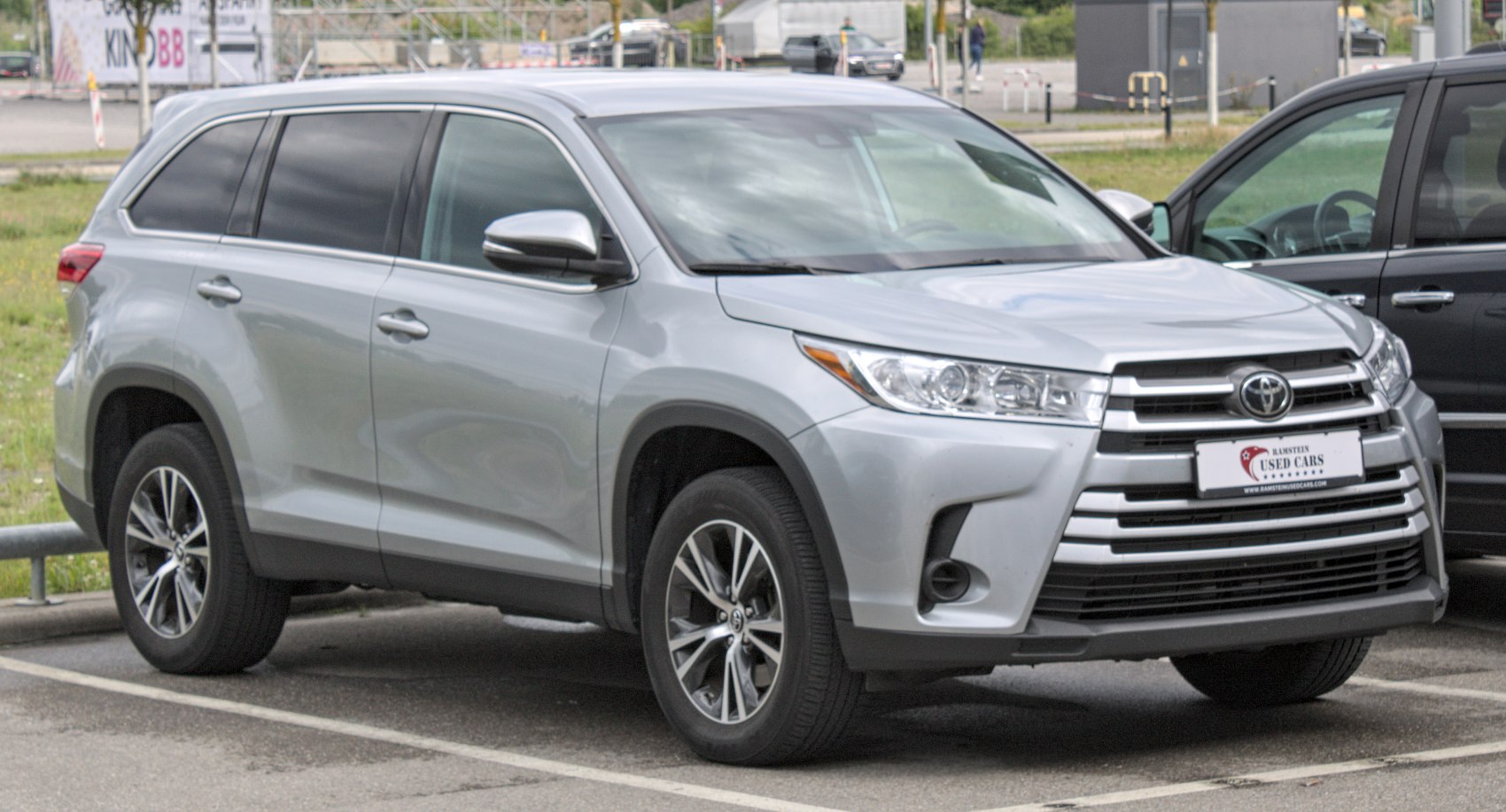 Silver SUV with updated grille and alloy wheels, front-side angle.